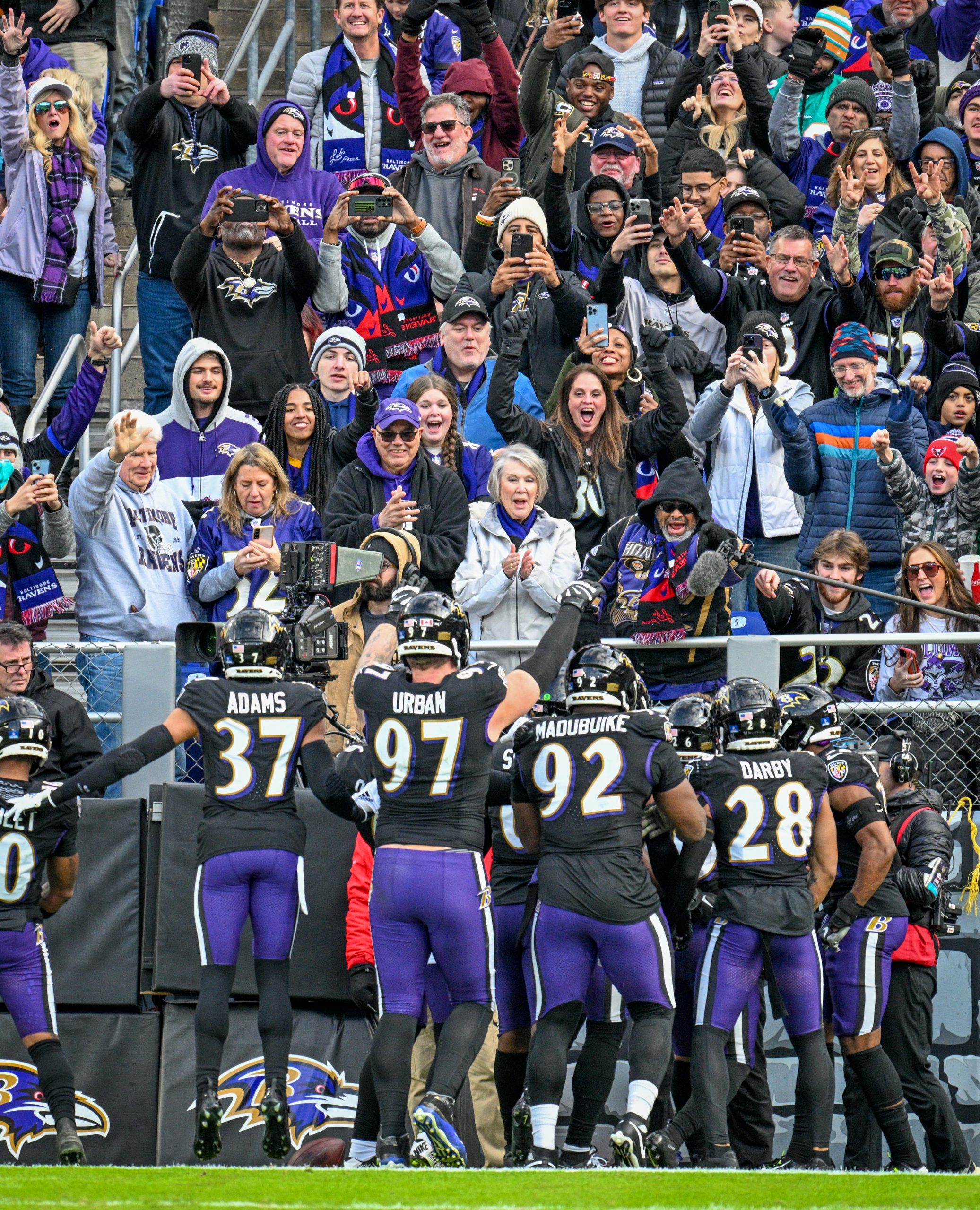 Ravens defenders celebrate in the end zone following an interception...