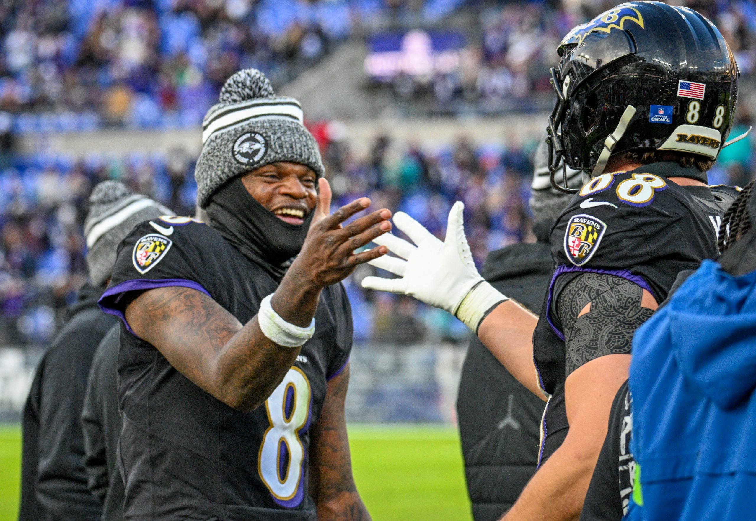 Baltimore Ravens quarterback Lamar Jackson congratulates Charlie Kolar on the...