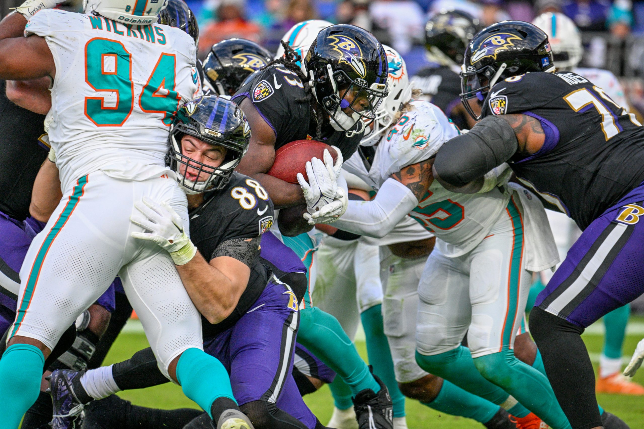 Baltimore Ravens Melvin Gordon III pushes through for a gain...
