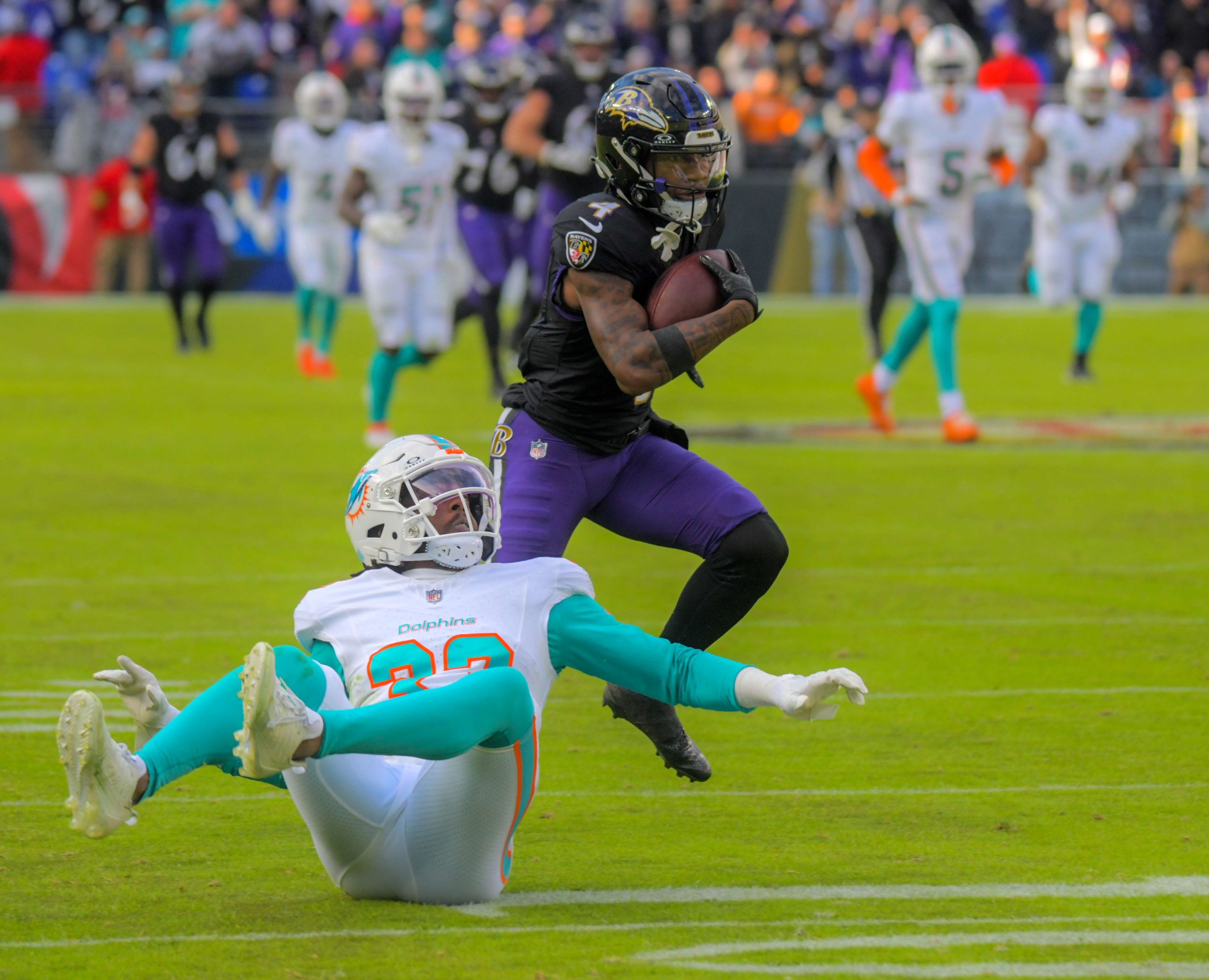 Baltimore Ravens wide receiver Zay Flowers, #4, cuts behind a...