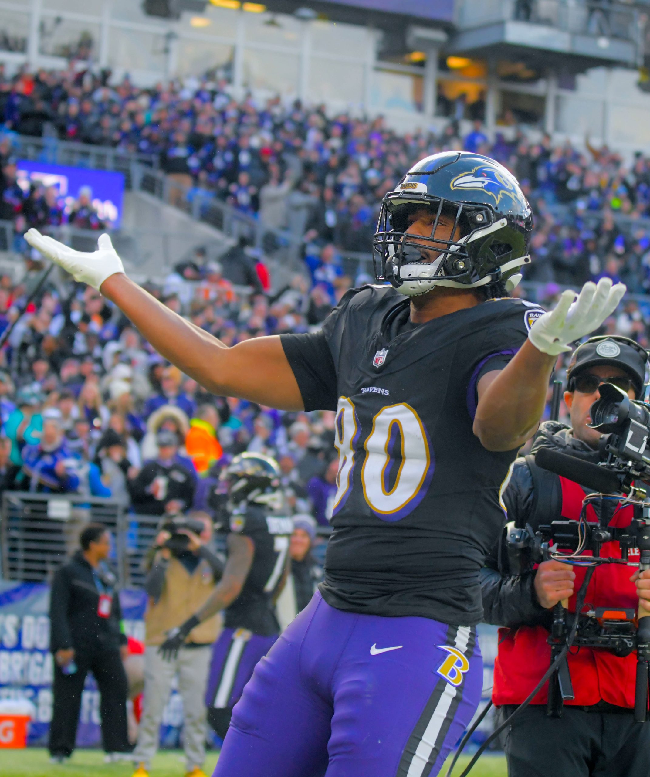 Ravens tight end Isaiah Likely reacts after scoring a touchdown...