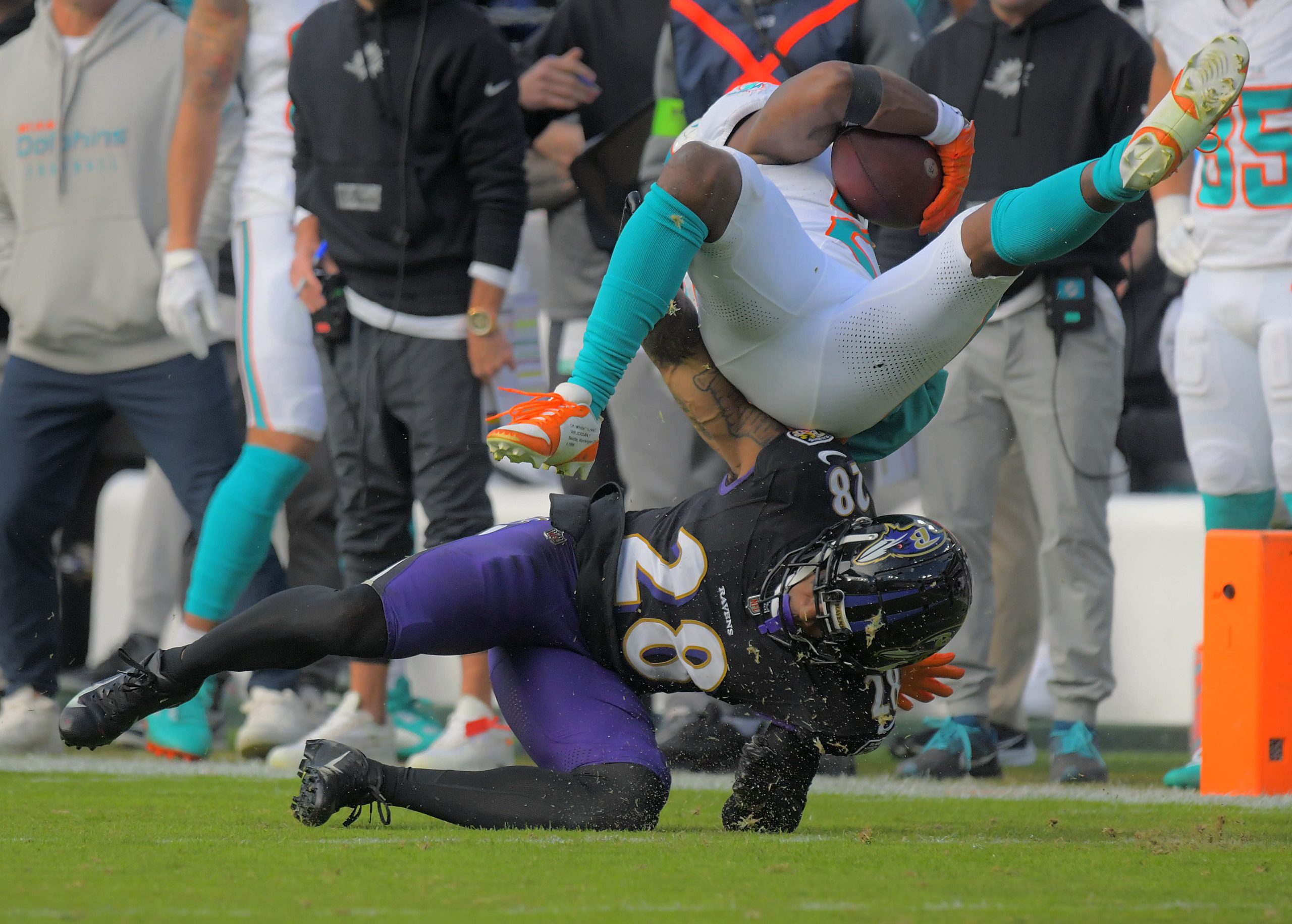 Baltimore Ravens cornerback Ronald Darby upends Miami Dolphins running back...