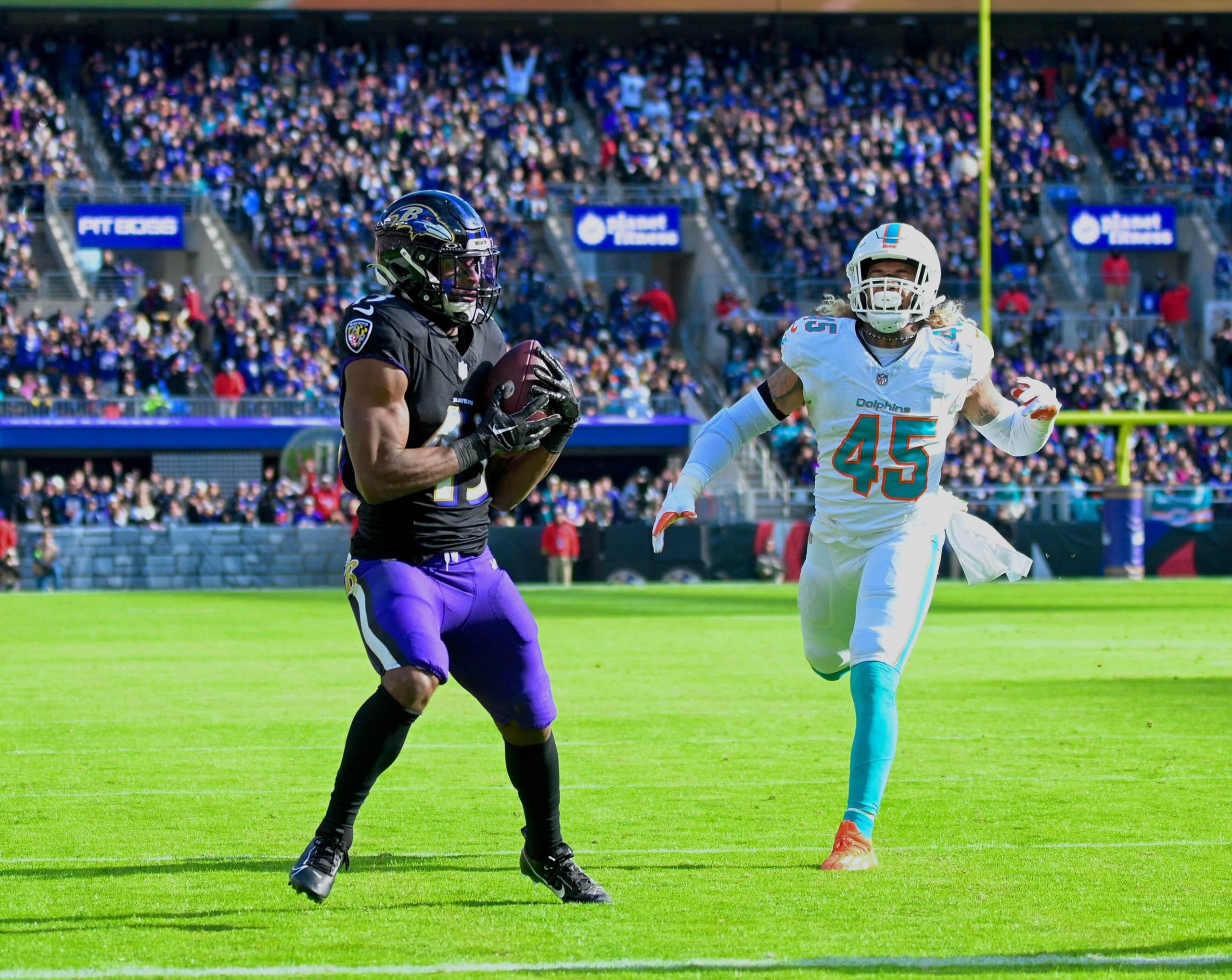 Ravens running back Justice Hill catches a touchdown pass in...