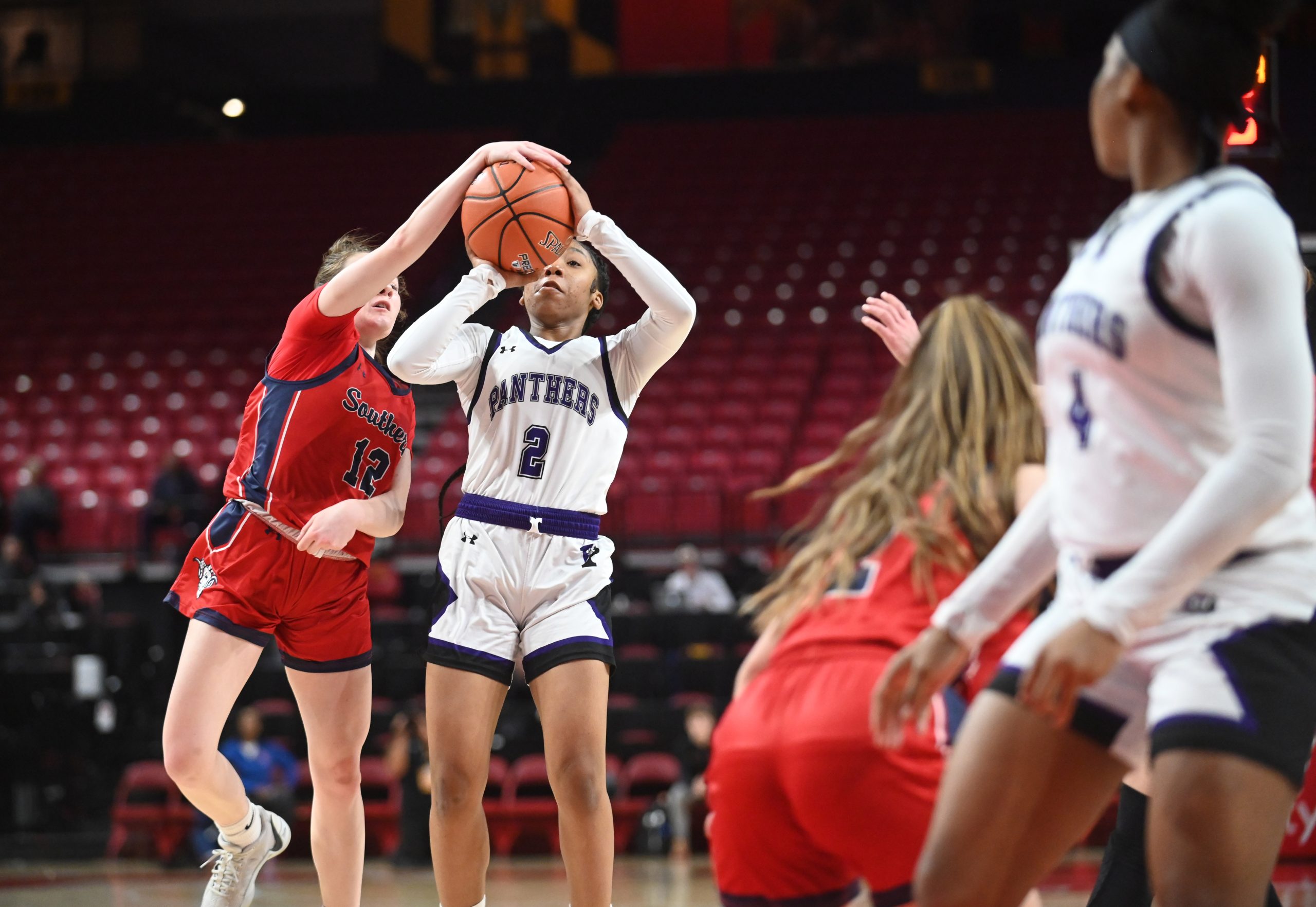Southern-Garrett's Abigail Teets, left, gets her hand on the ball...