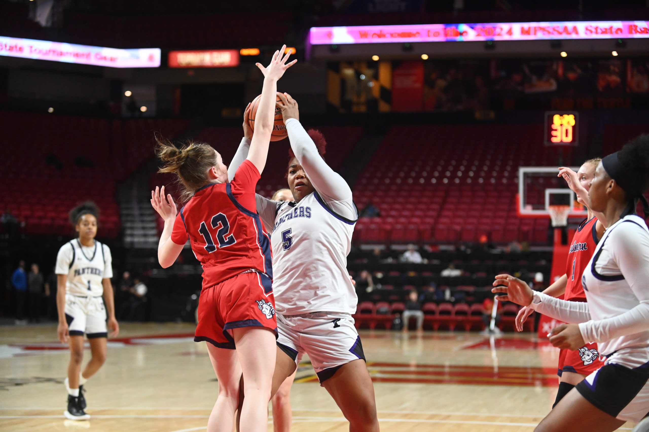Pikesville's Darielle Weems has difficulty getting a clear shot on...