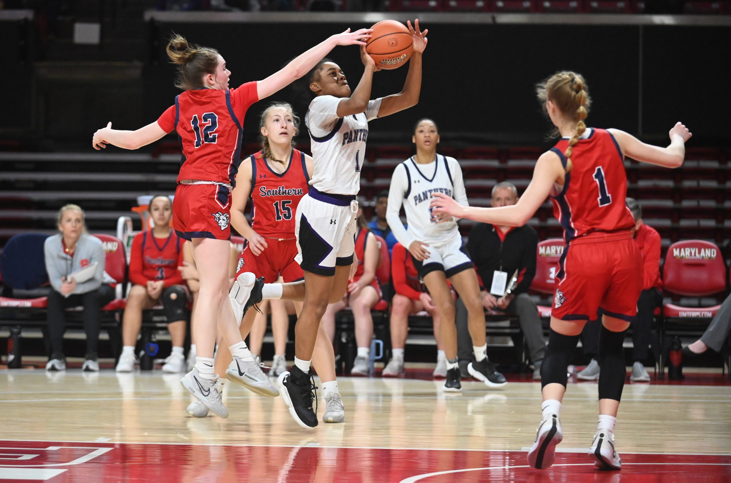 Southern-Garrett's Abigail Teets gets her fingers on the ball as...