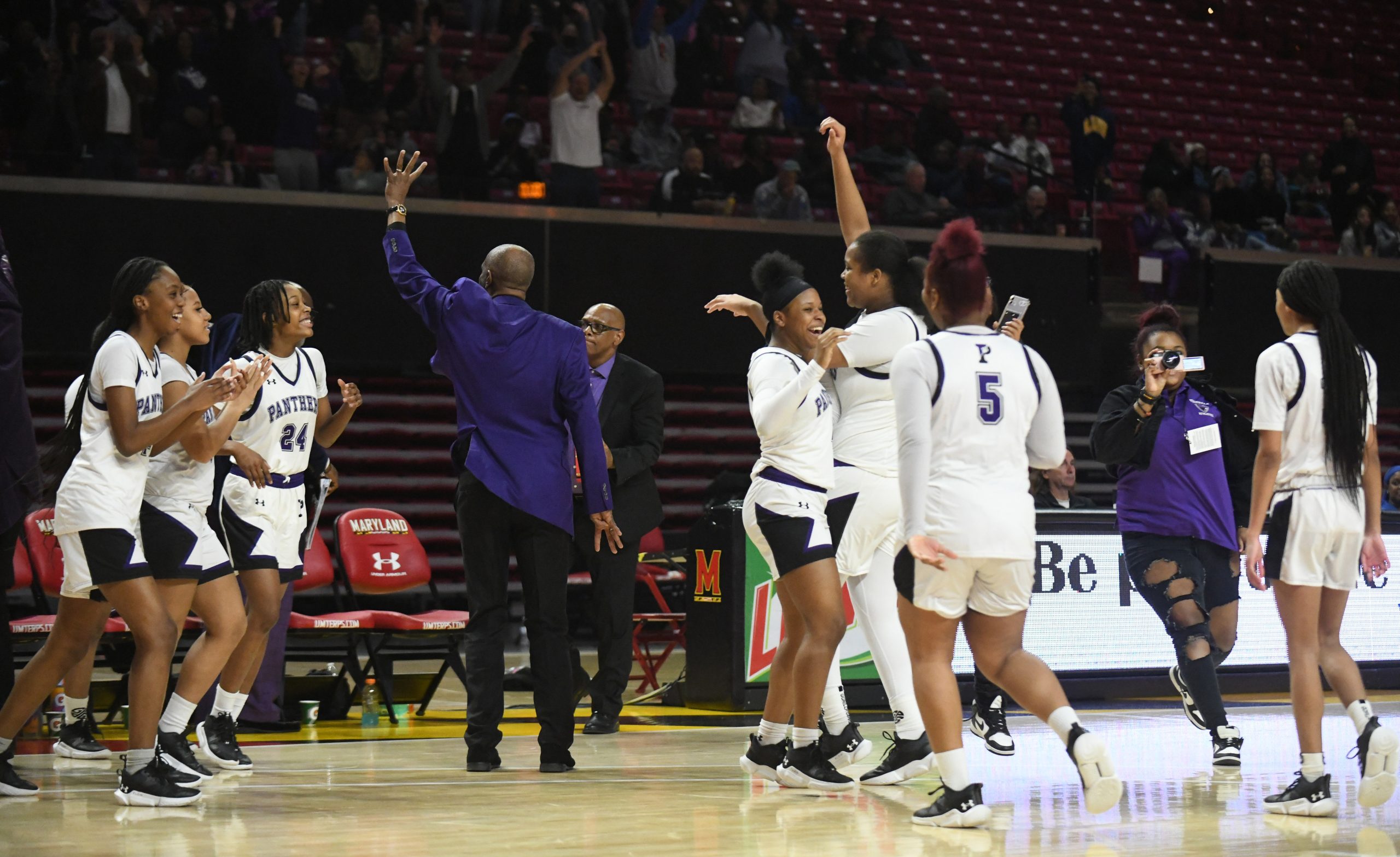 Pikesville's girls basketball team celebrates their win over Southern-Garrett in...