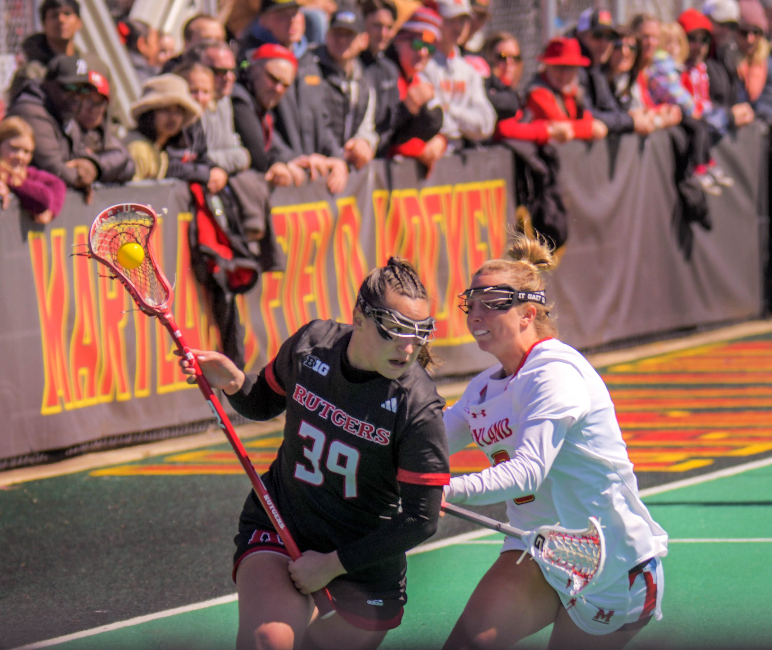 Maryland Terrapins attacker Chrissy Thomas covers Rutgers Scarlet Knights defender...