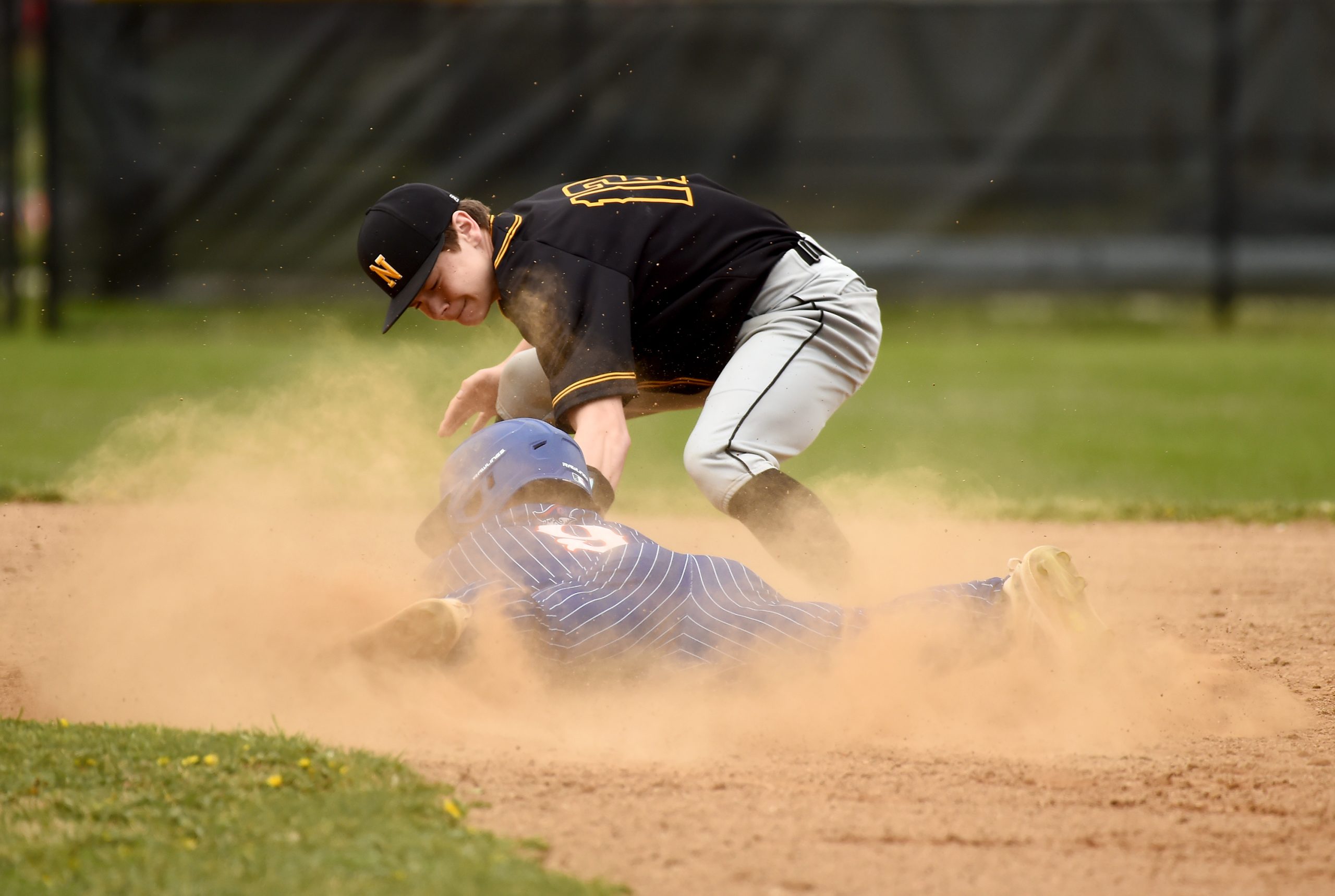 Old Mill’s Ayden Burton gets caught stealing at second base...