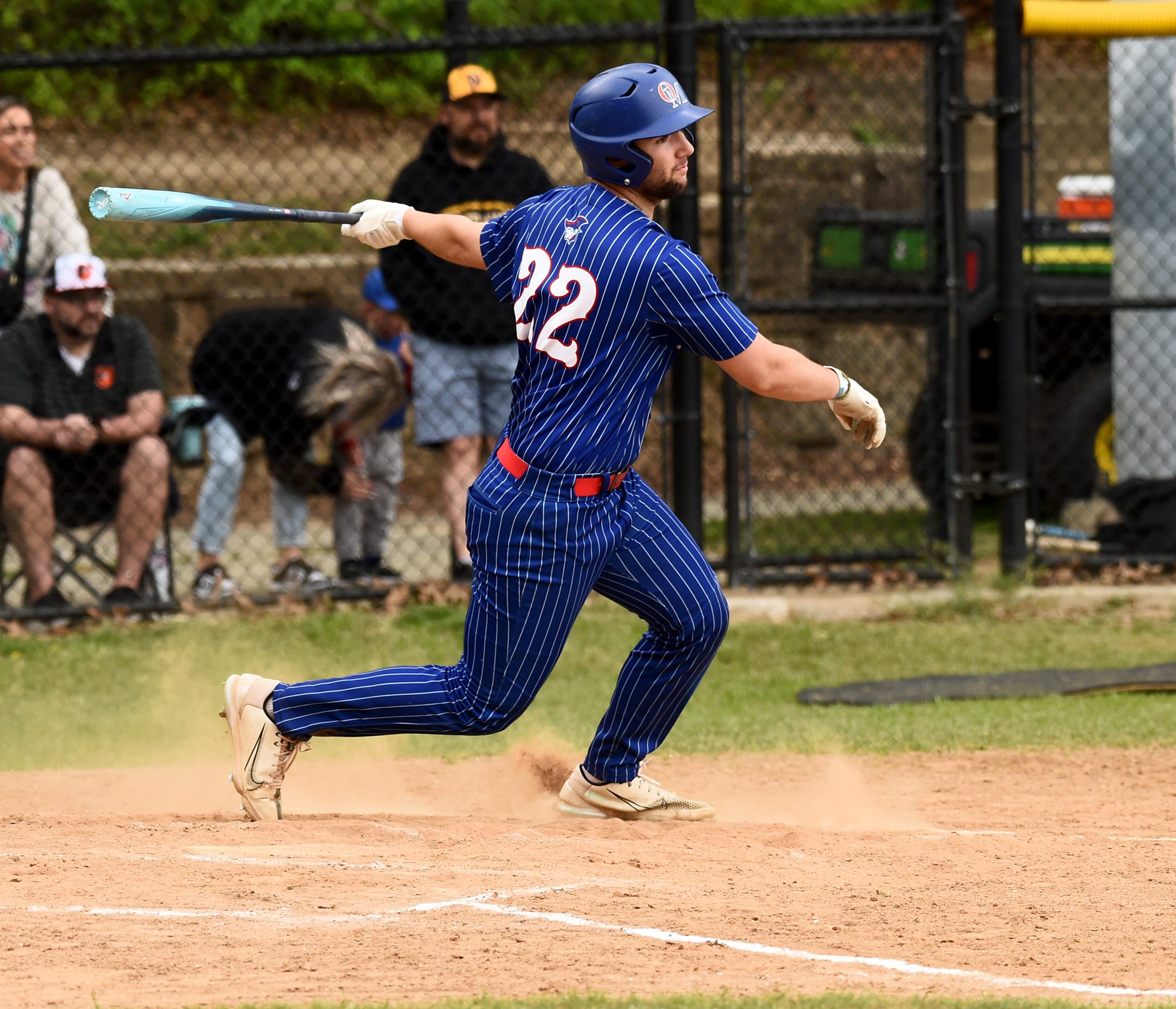 Old Mill’s Leo Gruber drives in a run on a...
