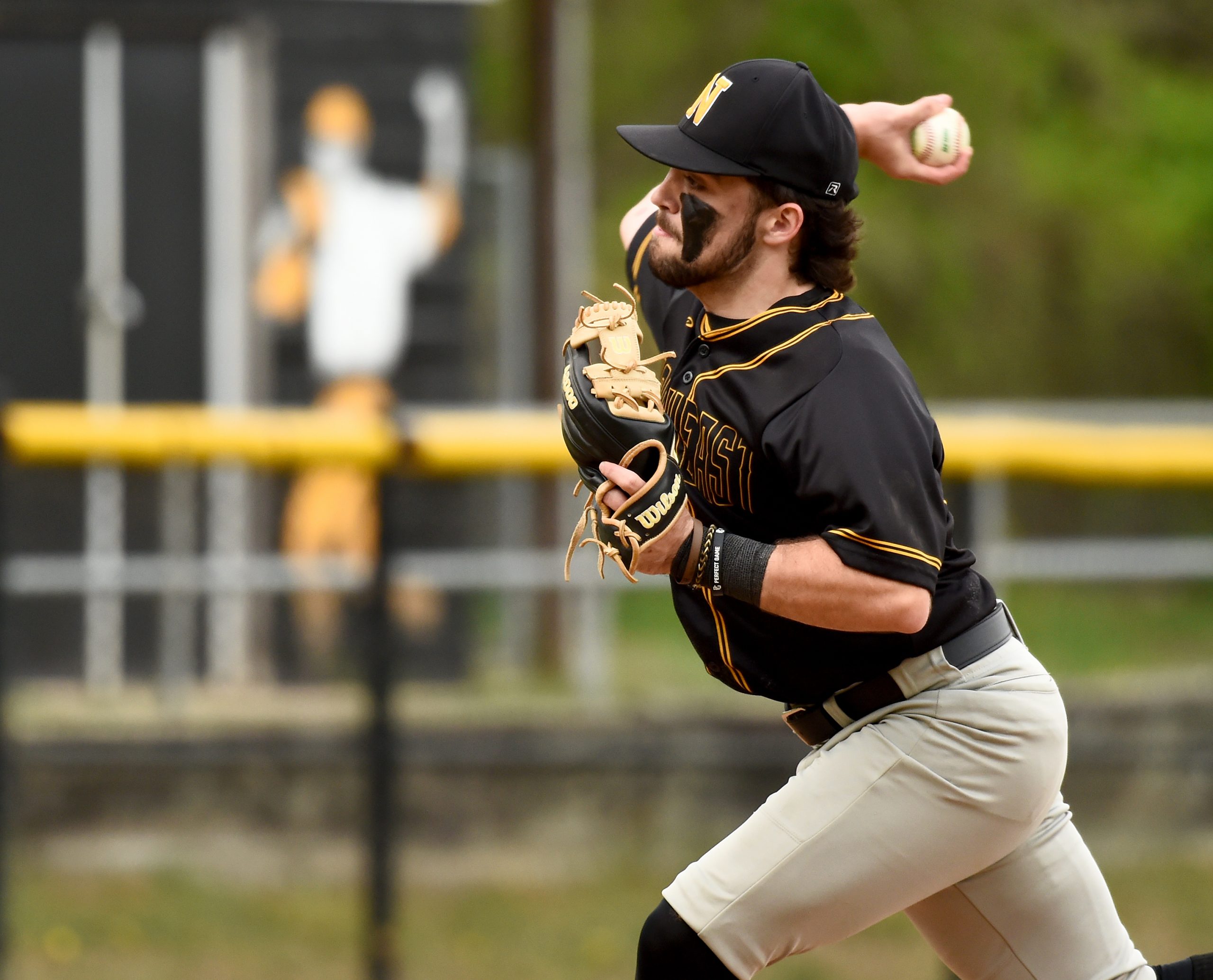 Northeast pitcher Mike Kooser throws in the second inning. The...