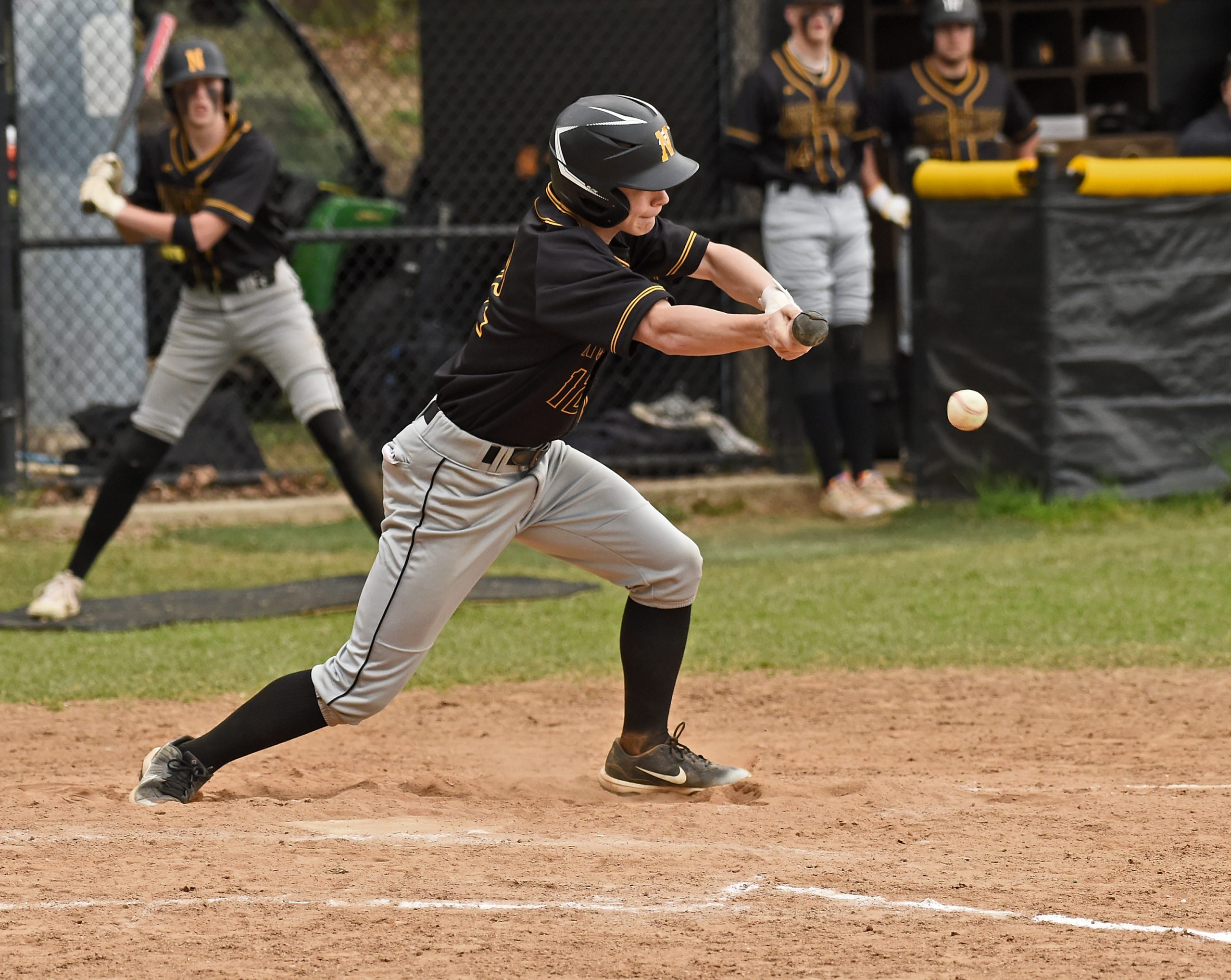 Northeast’s Bryce Peacock bunts in the third inning. The Northeast...