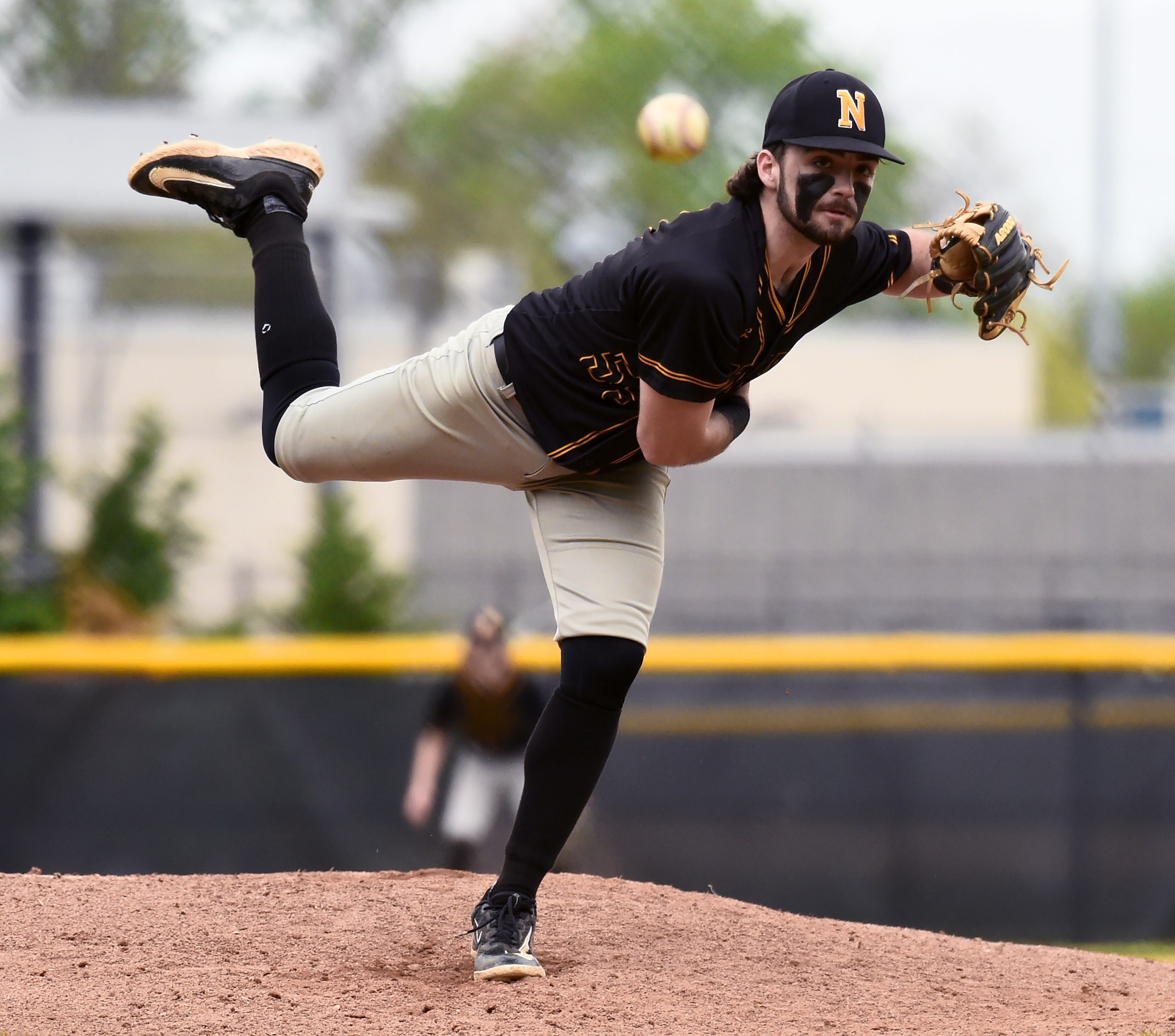 Northeast pitcher Mike Kooser throws in the fourth inning. The...