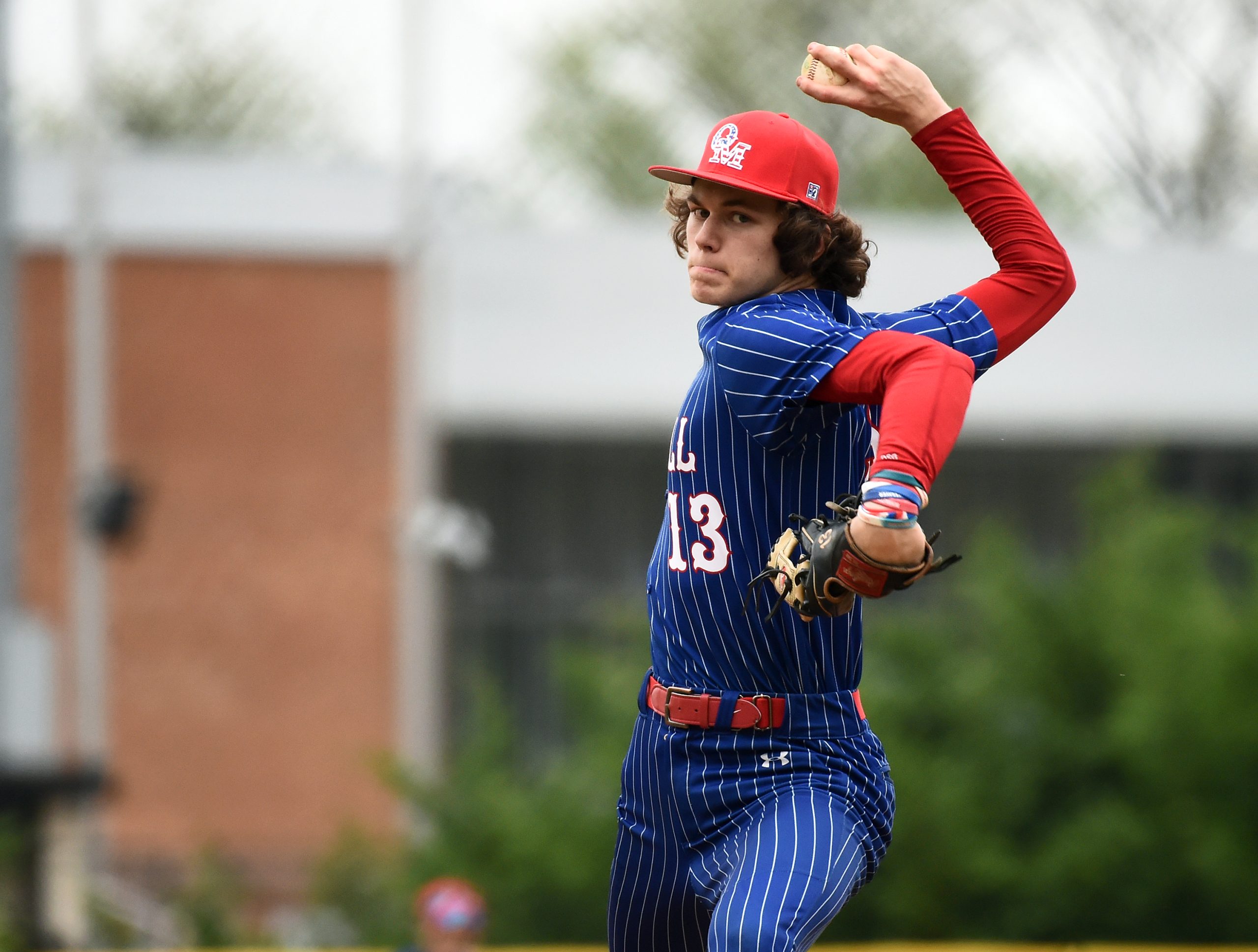 Old Mill pitcher Gavin Glos throws in the fourth inning....