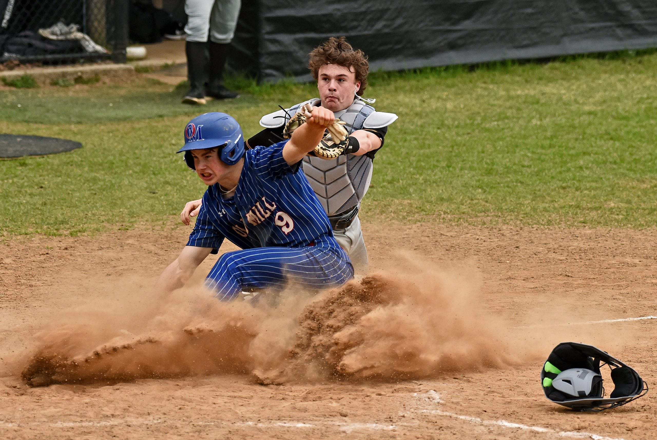 Old Mill’s Ayden Burton beats the tag at home by...
