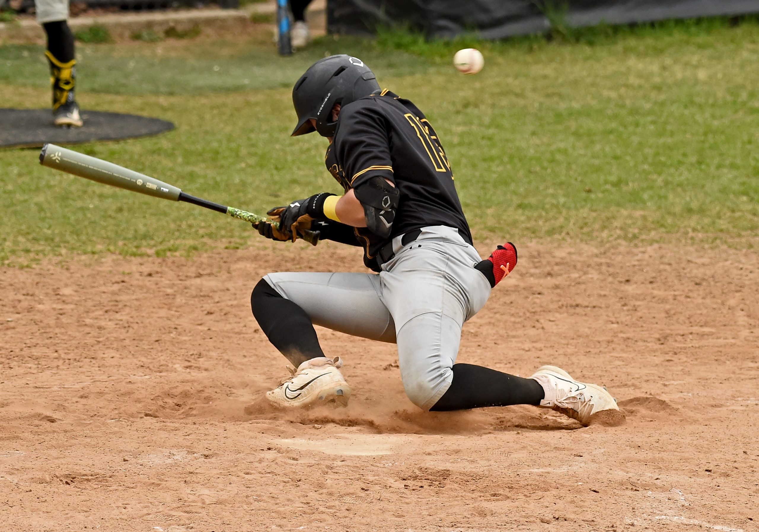 Northeast’s Chase McLaughlin ducks ball four for a walk in...