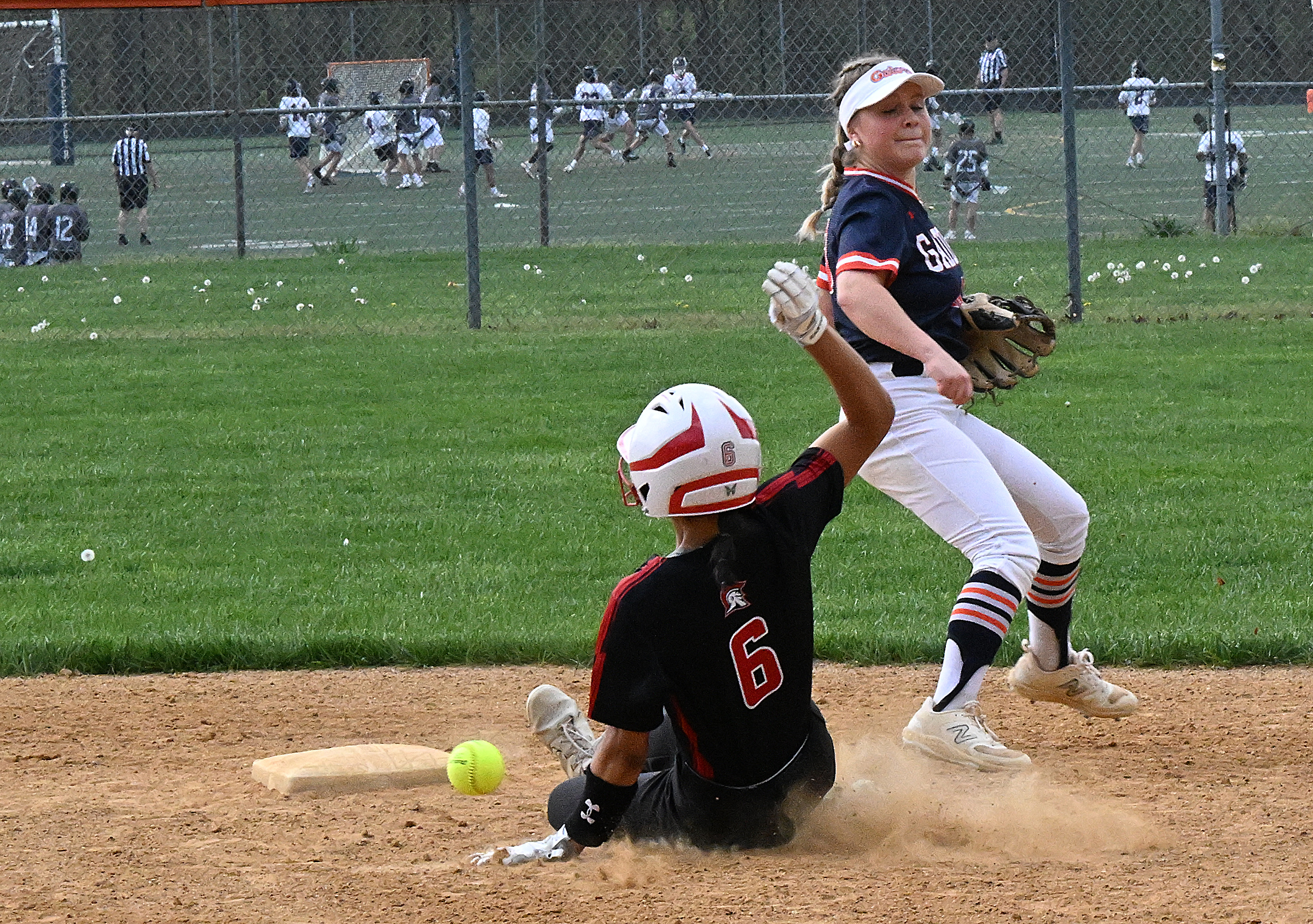 Glenelg #6, Abiola Owens, is hit by the ball on...