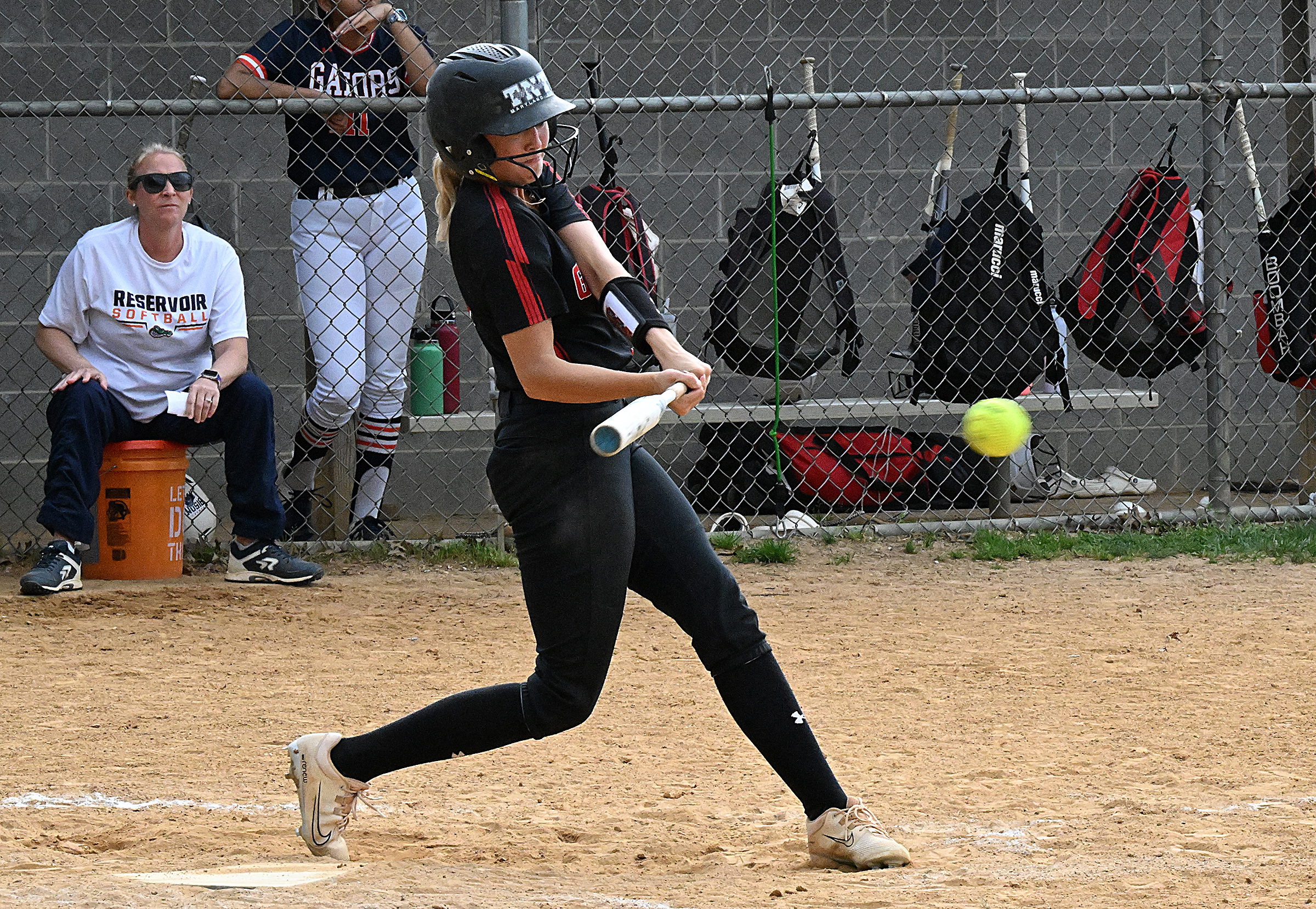 Glenelg's Reese Holden hits a two-run double to center field...