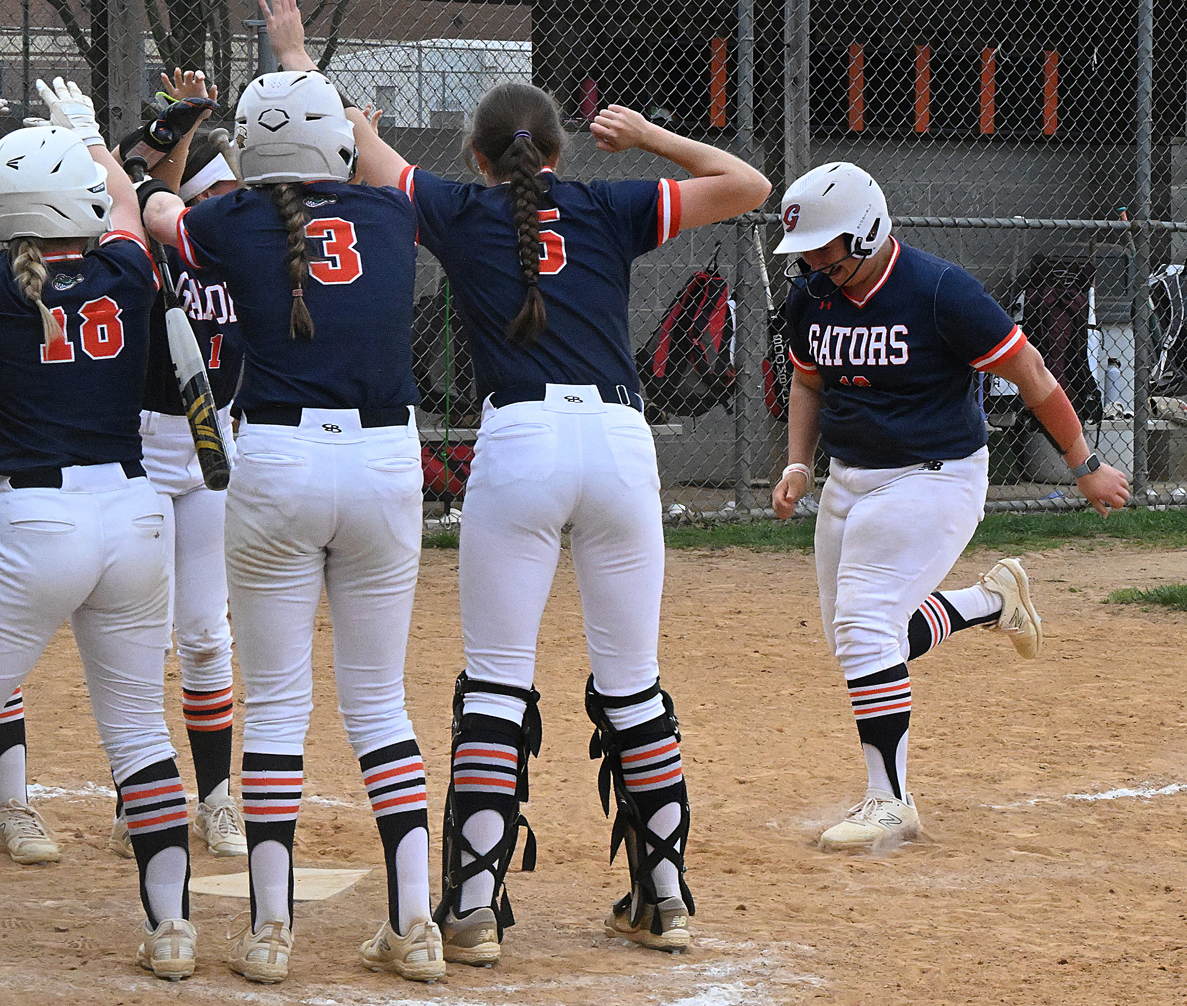 Reservoir #16, Cambell Sagin is met at home plate by...