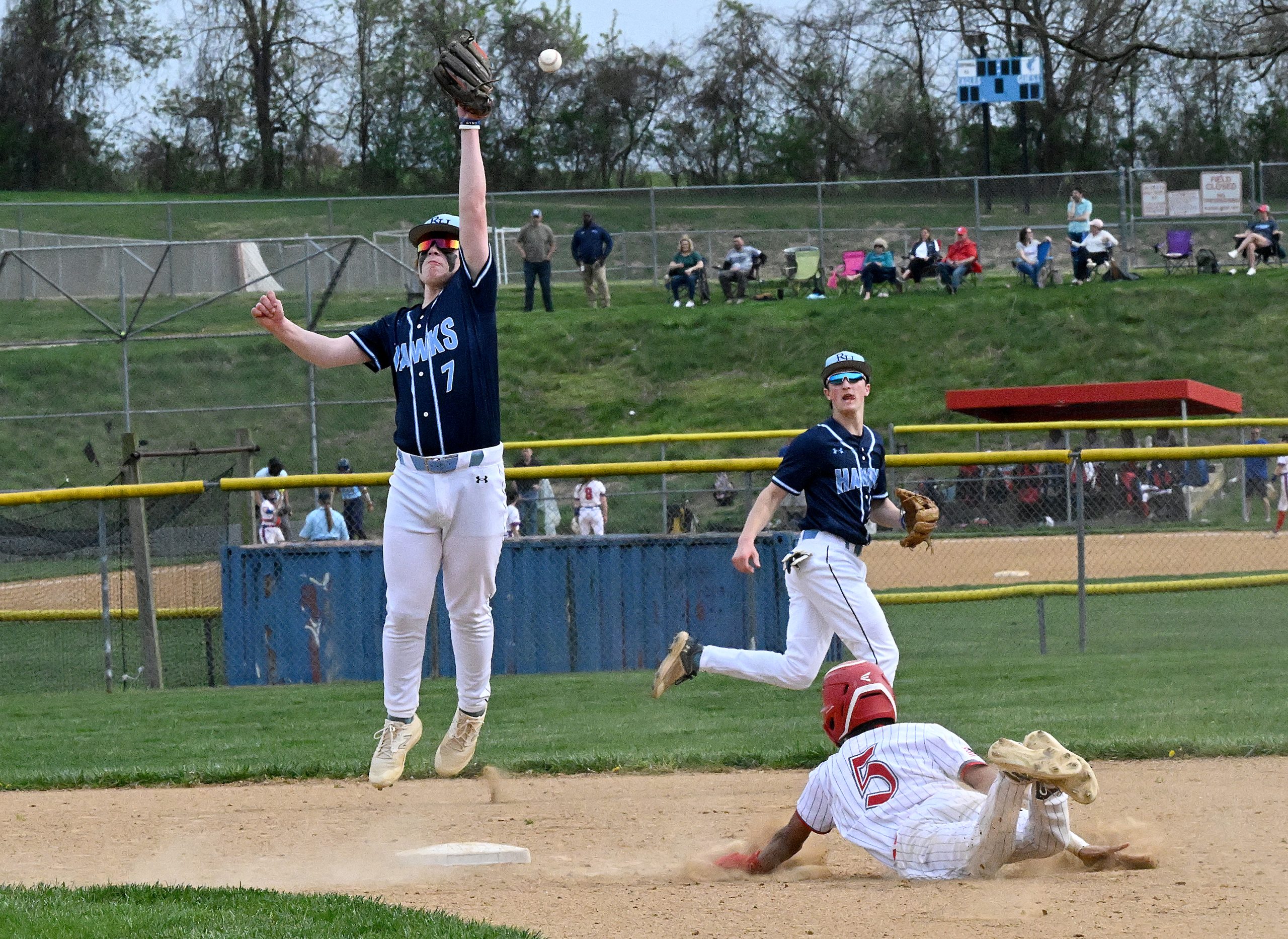 River Hill #7, Avi Fields can't crab a high throw...