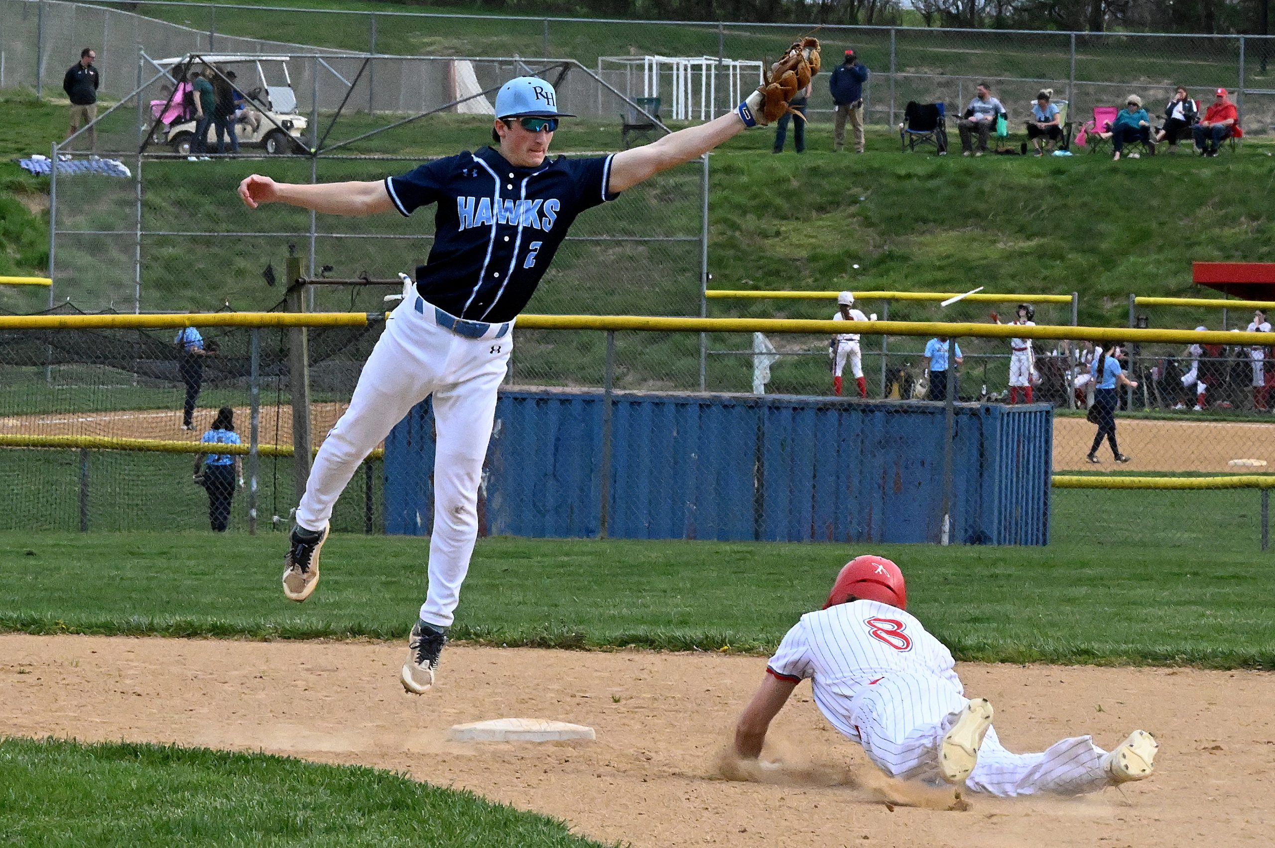 Centennial #8, Zack Kelly steal second on a high throw...