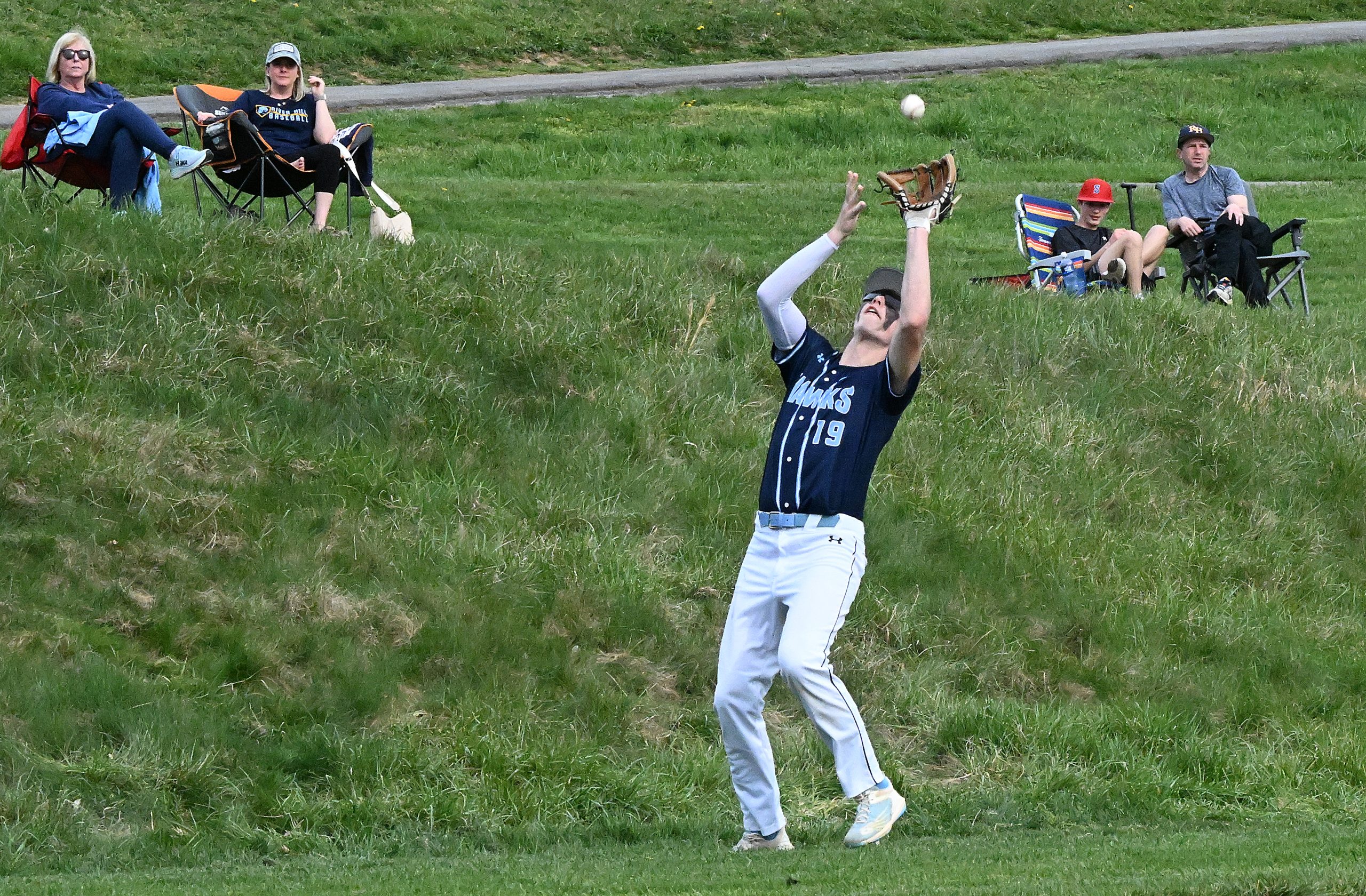 River Hill 3rd baseman #19, Ryan Walsh makes a play...