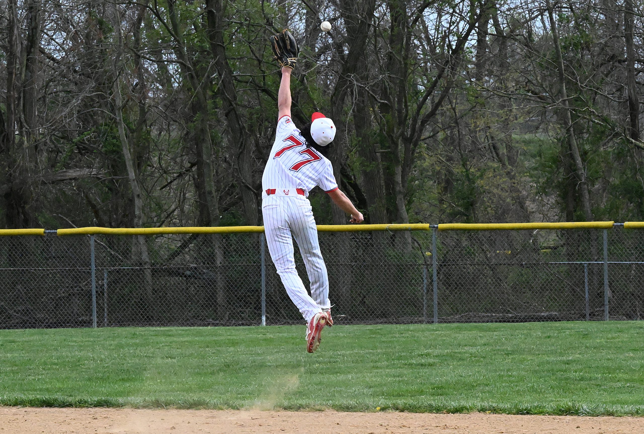 Centennial 2nd baseman #77, Aiden Gauthier climbs the ladder but...