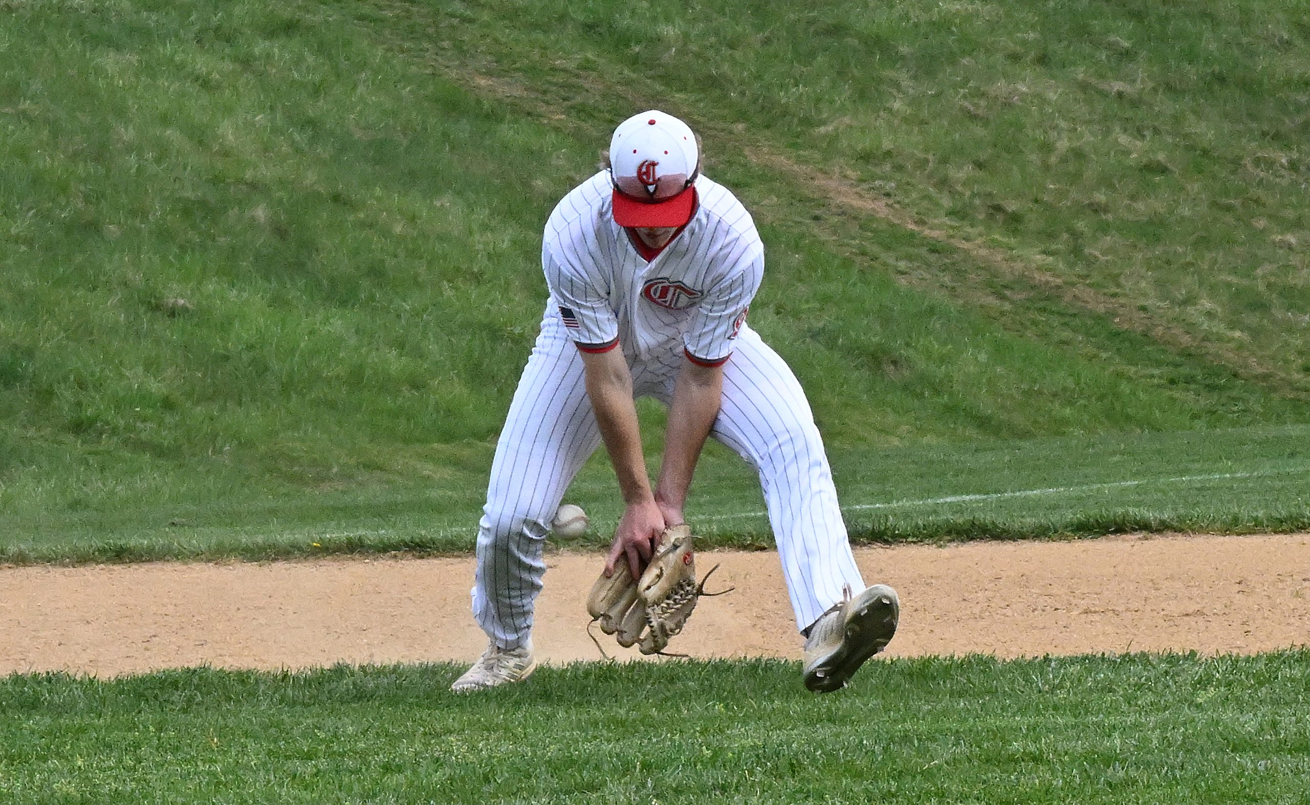 Centennial 3rd bvaseman, #9, Jack Stachera misplays a tricky one...