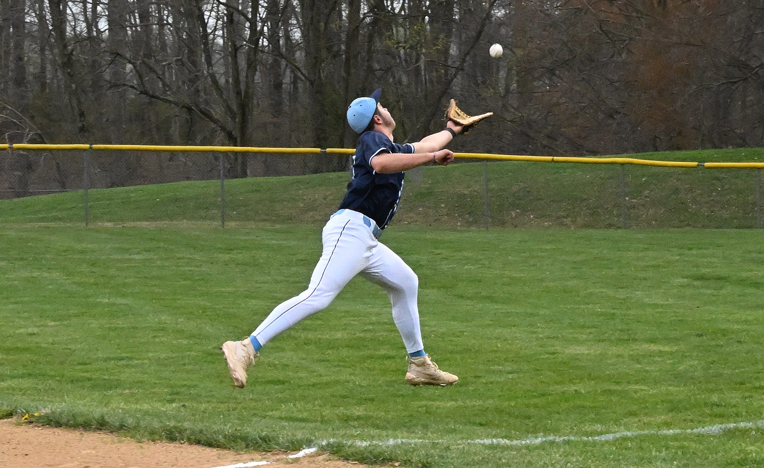 River Hill 1st baseman #23, Jonathan Norwood can't catch up...