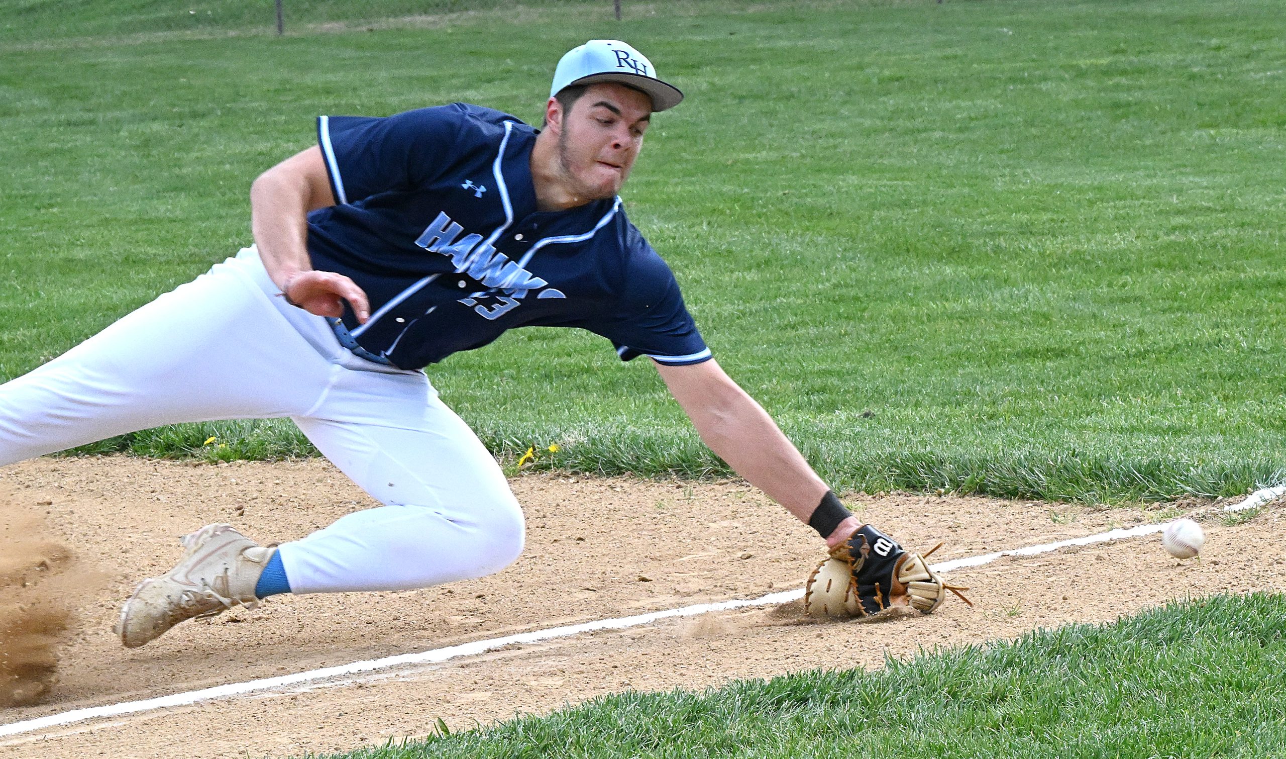 River Hill 1st baseman #23 Jonathan Norwood just misses a...