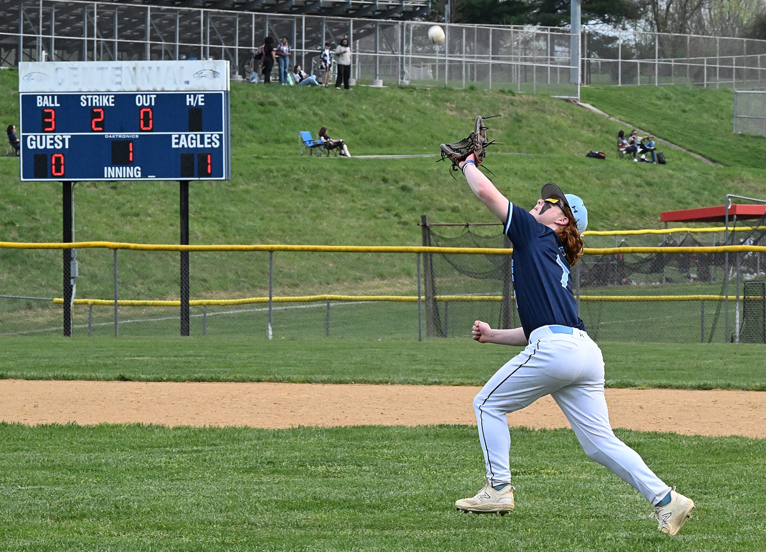 River Hill 2nd baseman #7, Avi Fields makes a play...