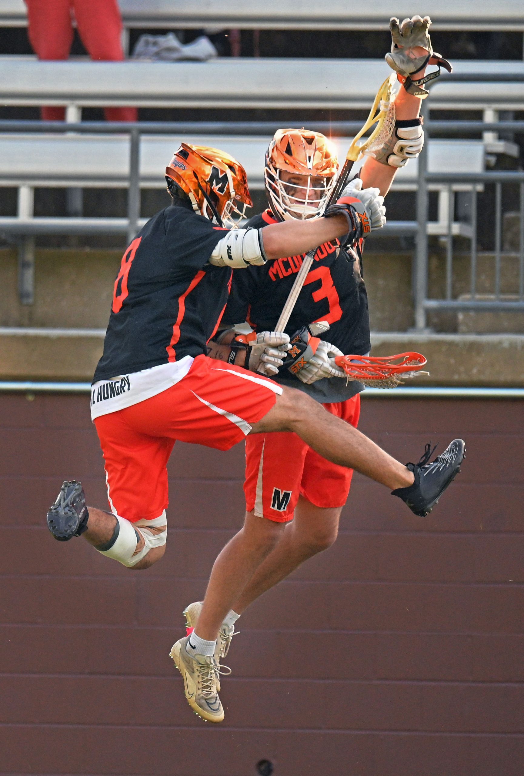 McDonogh’s Bogue Hahn, right, celebrates his empty goal score with...