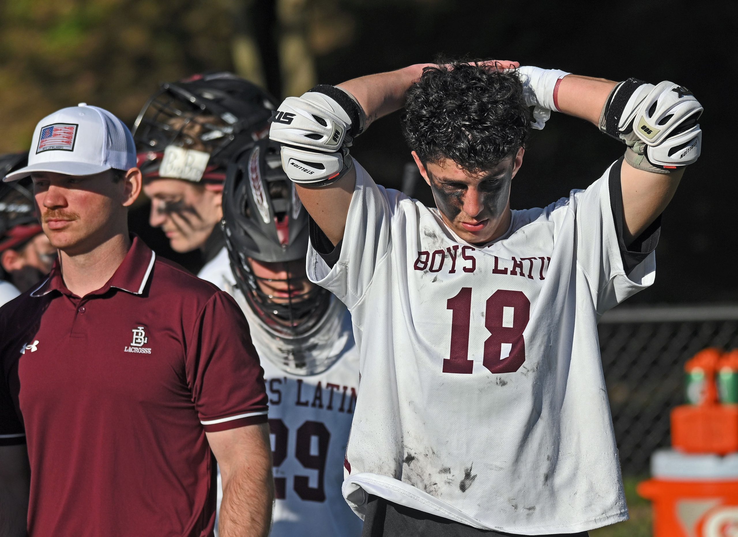 Boys’ Latin’s Spencer Ford, right, reacts in dejection after 12-10...