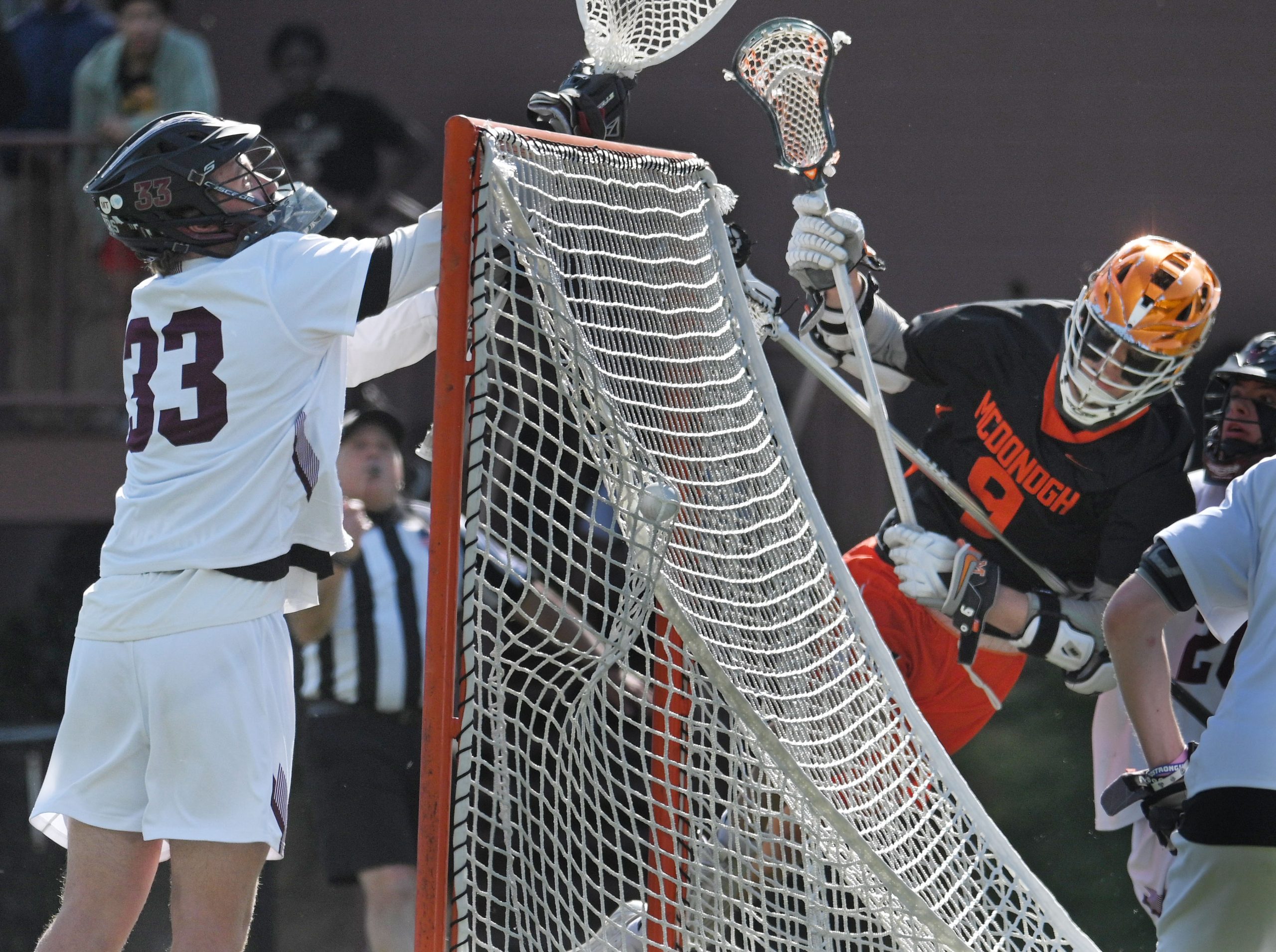 McDonogh’s Brendan Millon, right, scores his team’s first goal against...