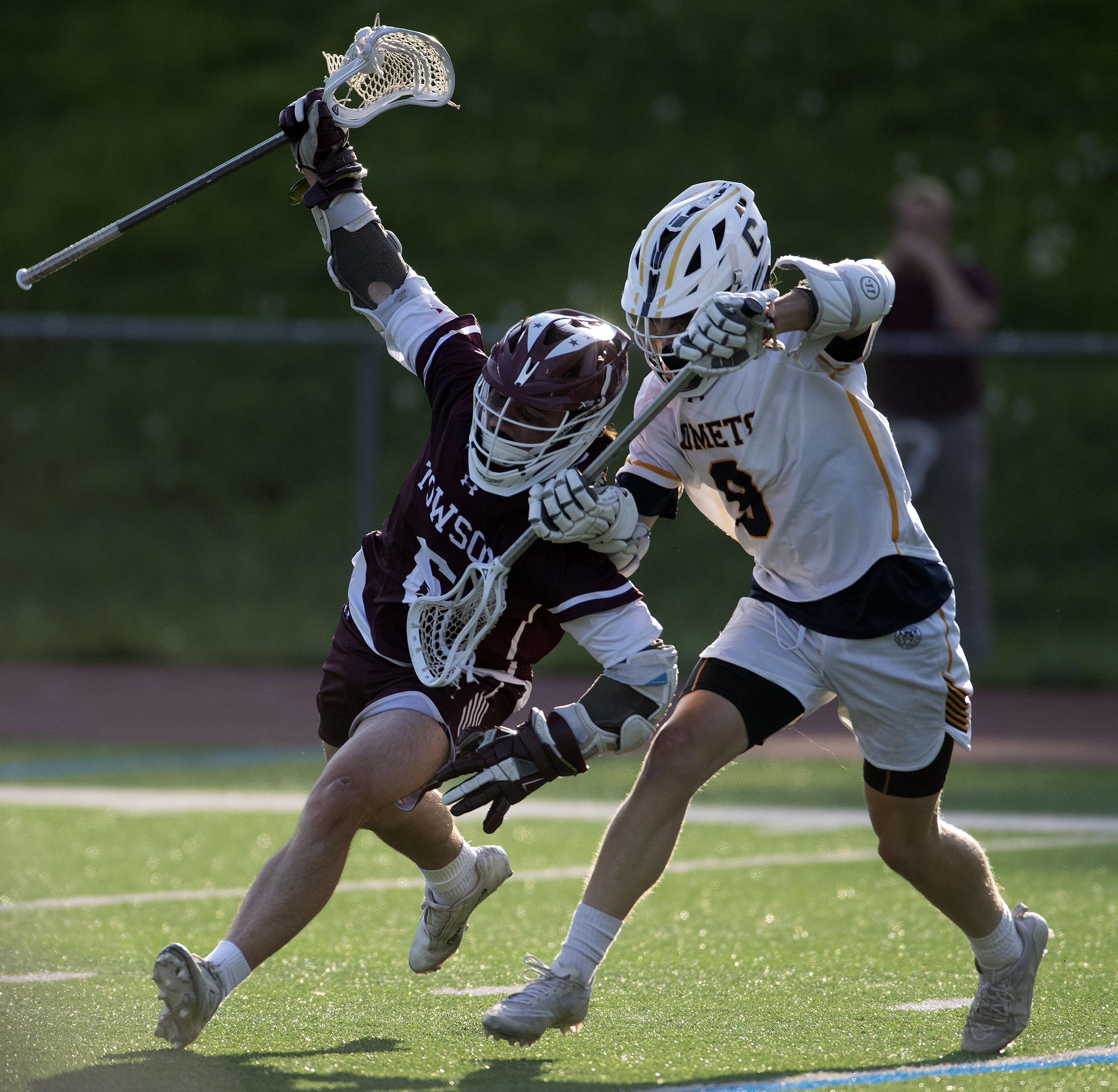 Towson’s Alex Tyler, left, maneuvers the ball around Catonsville’s Colin...