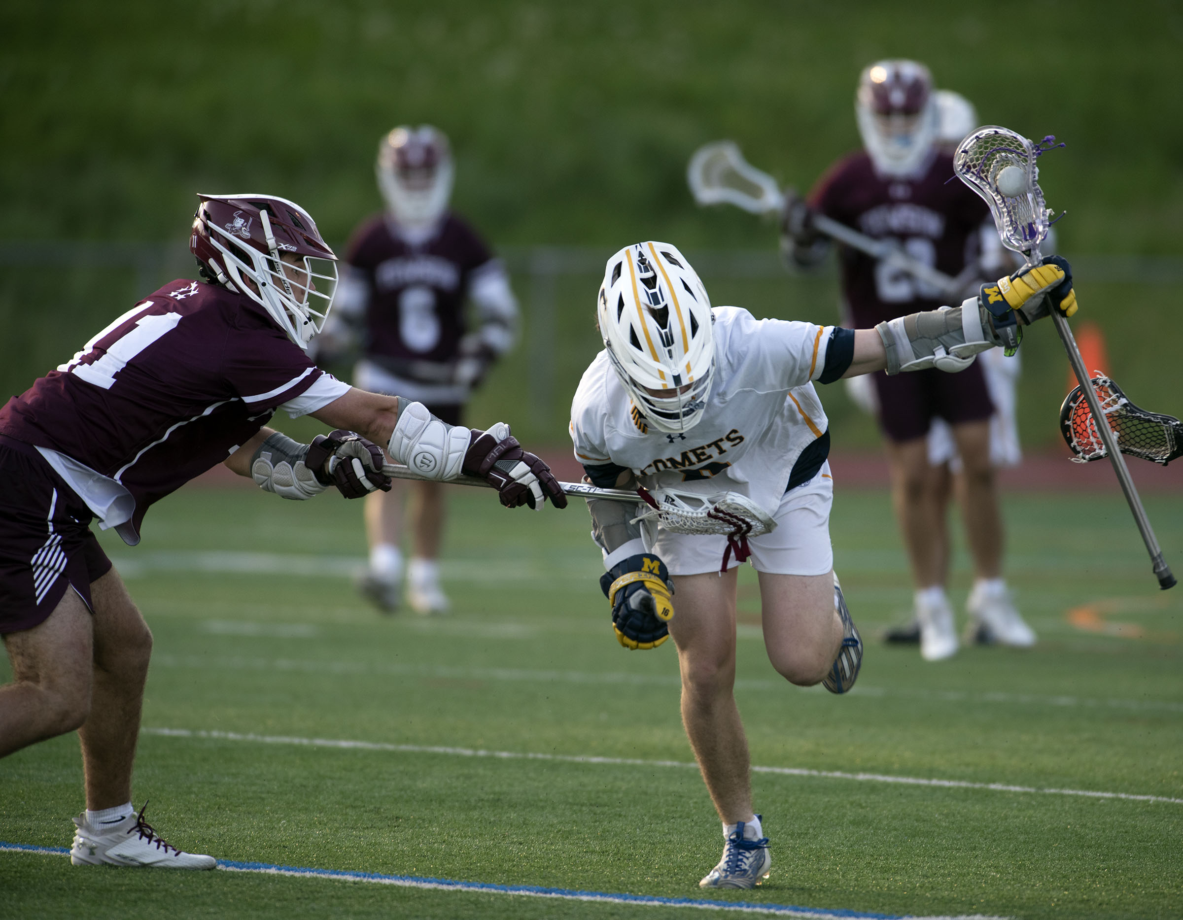 Catonsville’s Ben Hipzer, right, keeps the ball away from Towson...