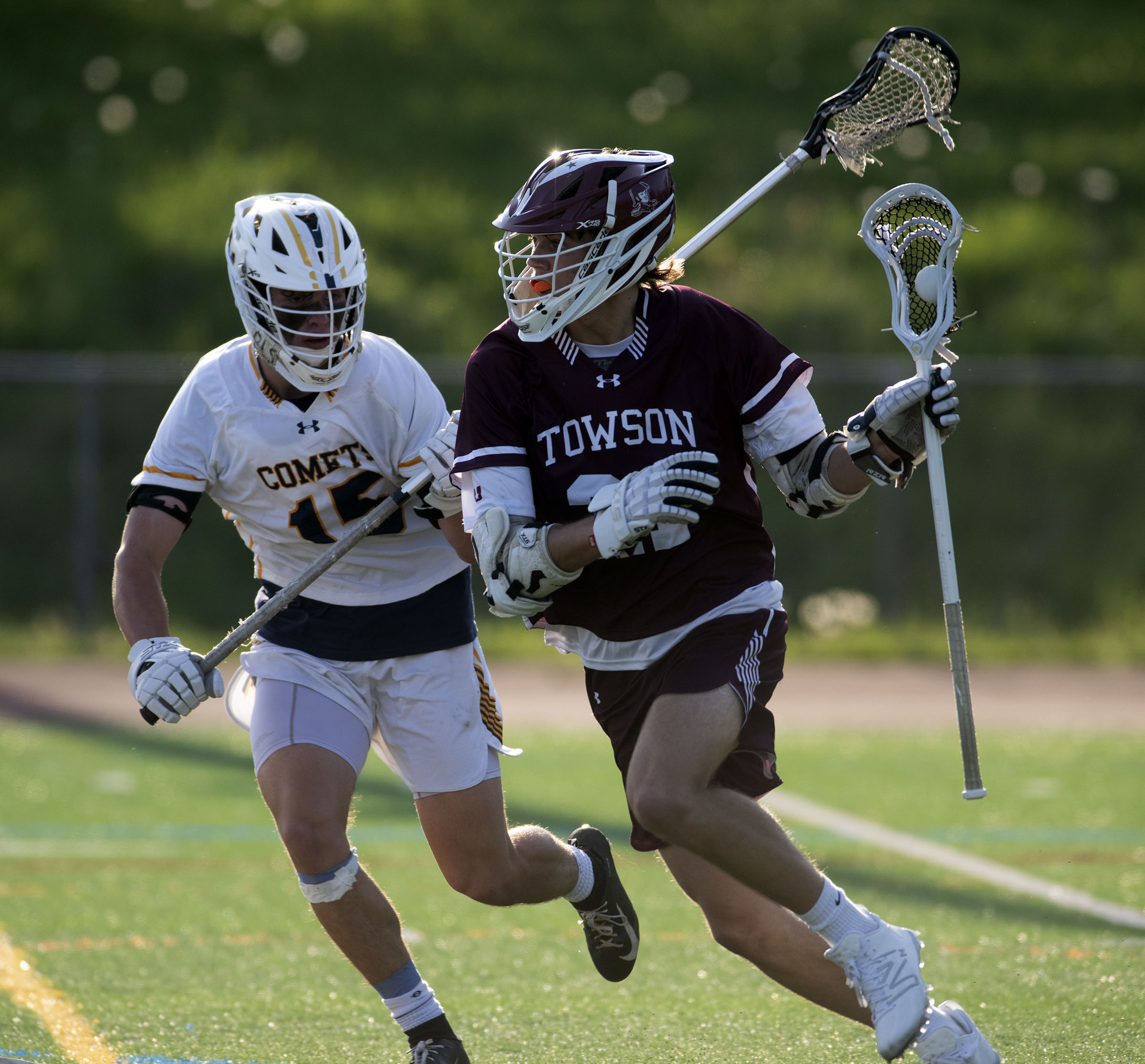 Towson’s Connor Parks, right, moves the ball against Catonsville’s Sam...