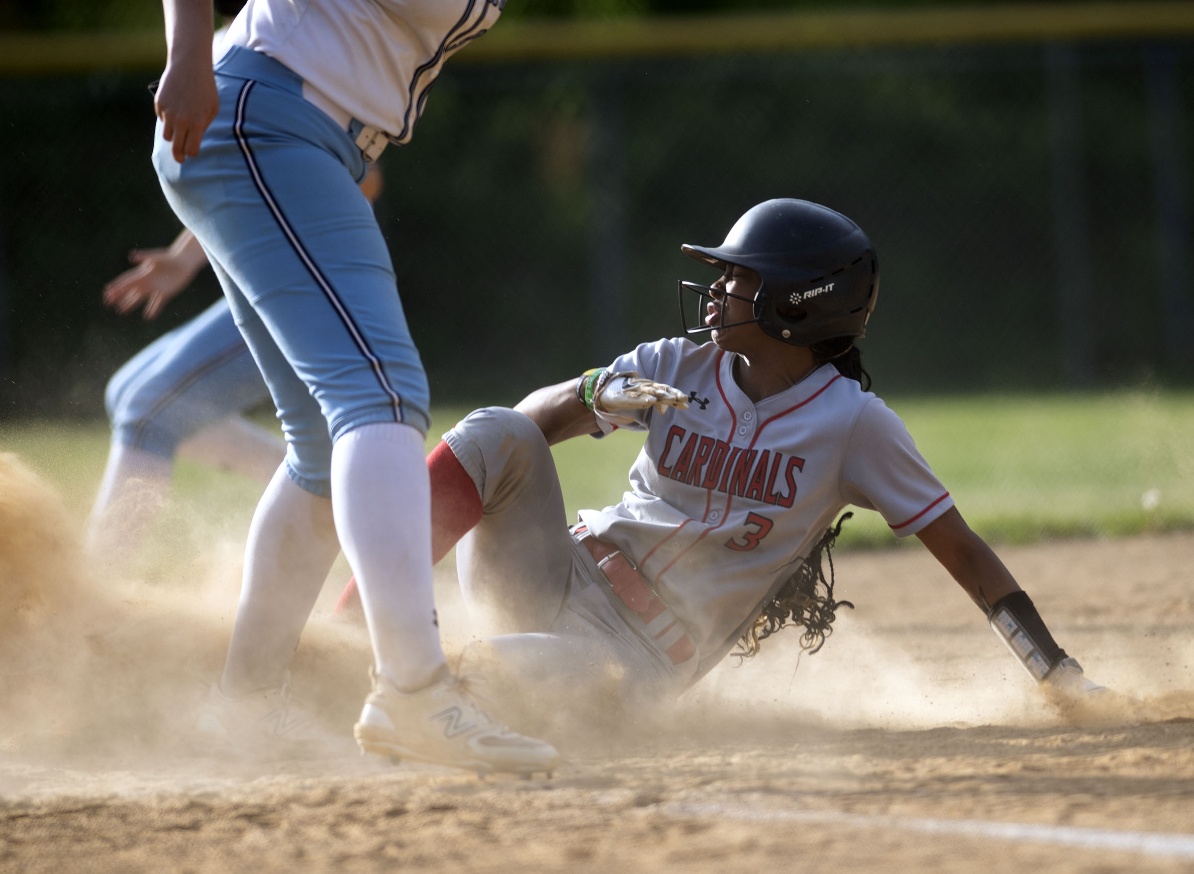 Crofton’s Alanna Yancey slides into third with a stolen base...