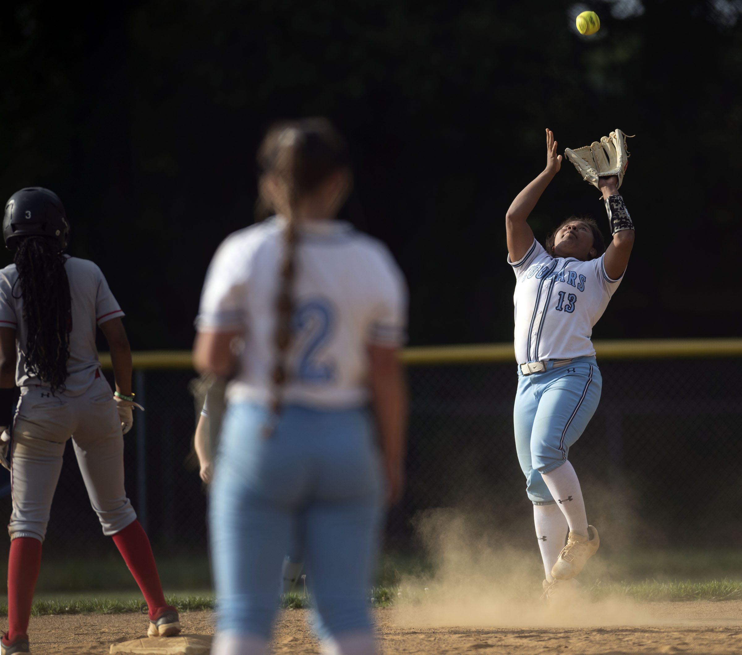 Chesapeake second baseman Alana Watts catches a pop fly for...