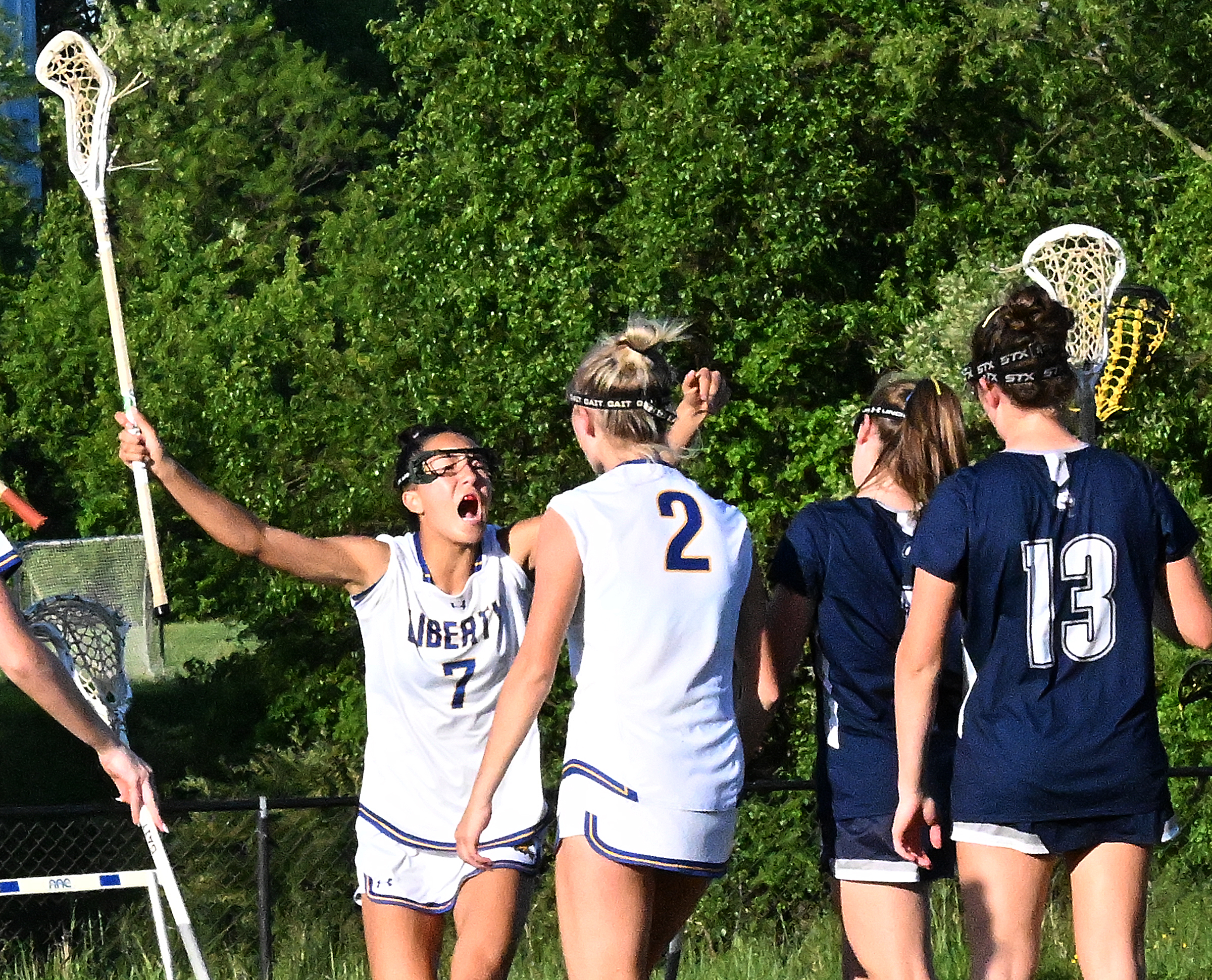 Liberty #7, Annika Wray celebrates after Kourtney Goff, #2, scored...