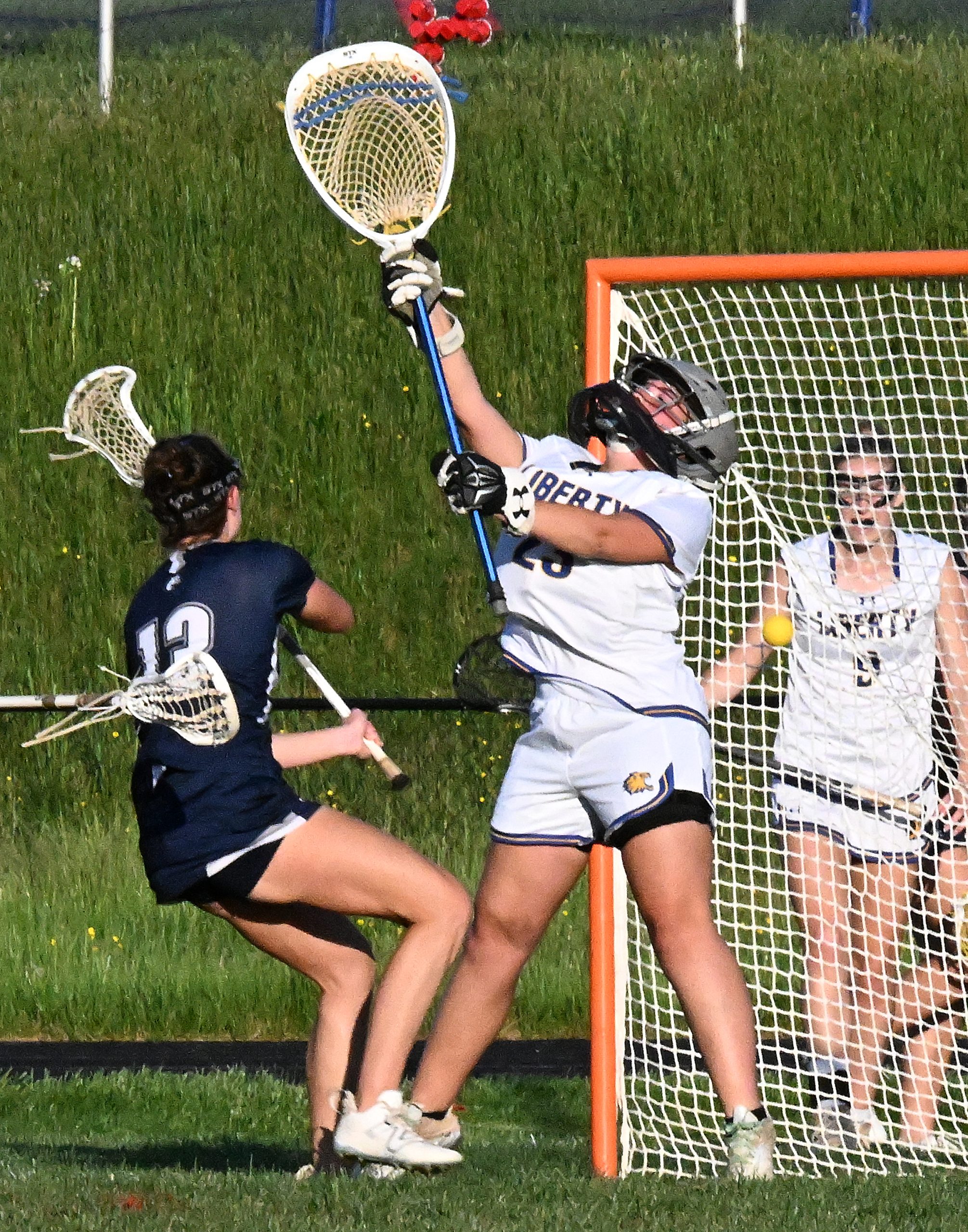 Manchester Valley #13, Taylor Fique fires one past Liberty goalie...
