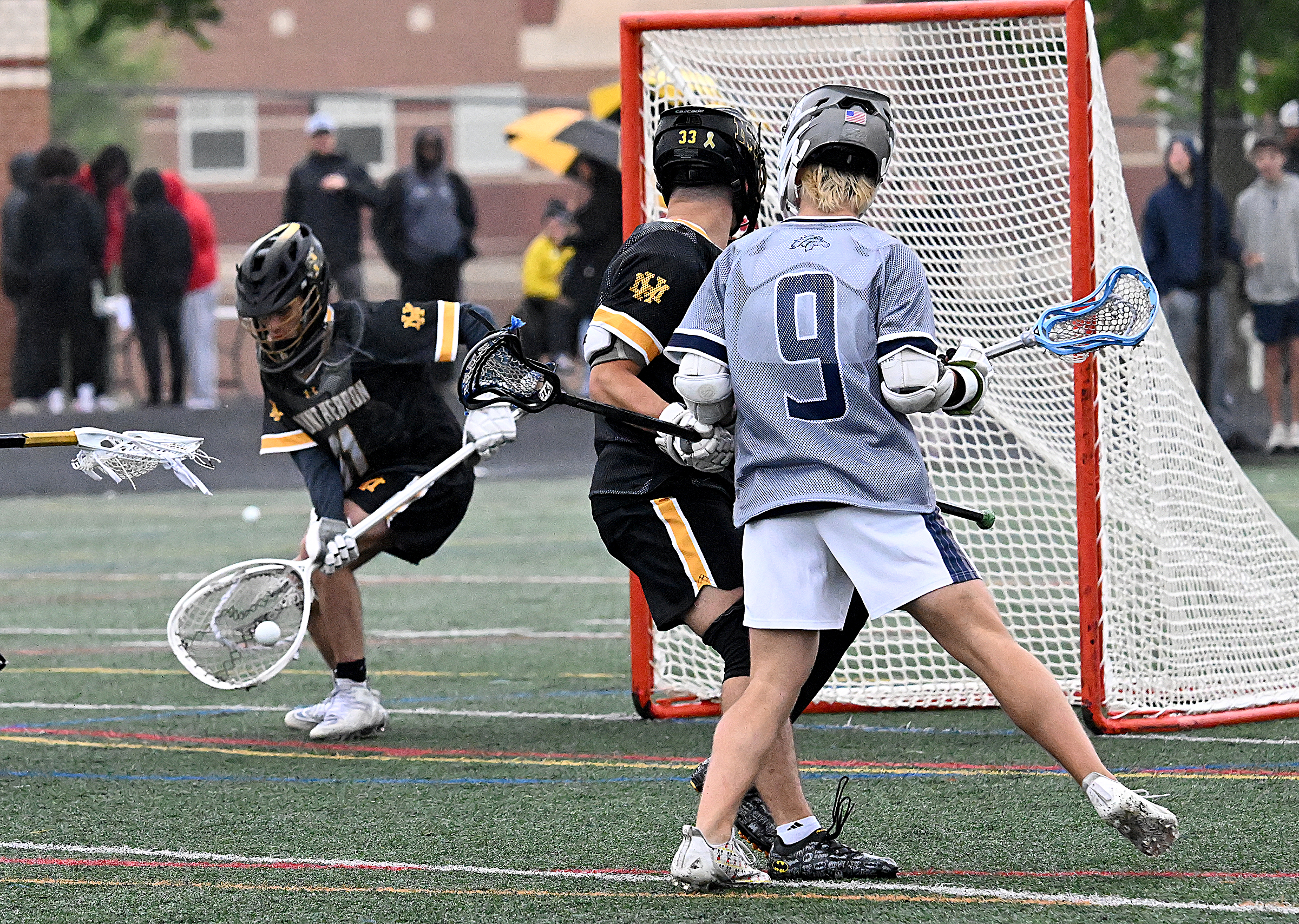 Mt. Hebron goalie #11, Luca LeClaire makes a save in...