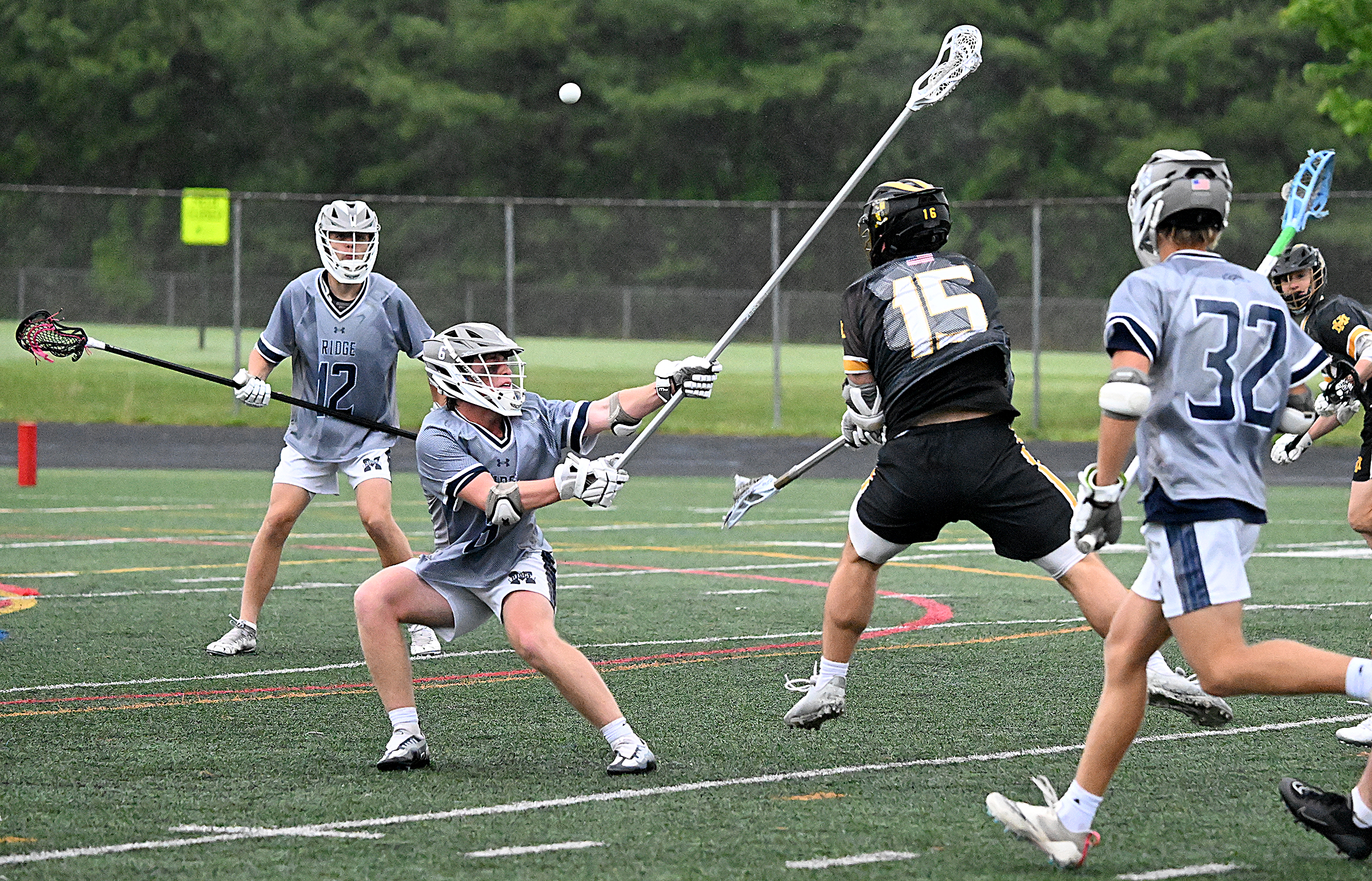 Mt. Hebron #15, Doug Cohen wins the faceoff and scores...