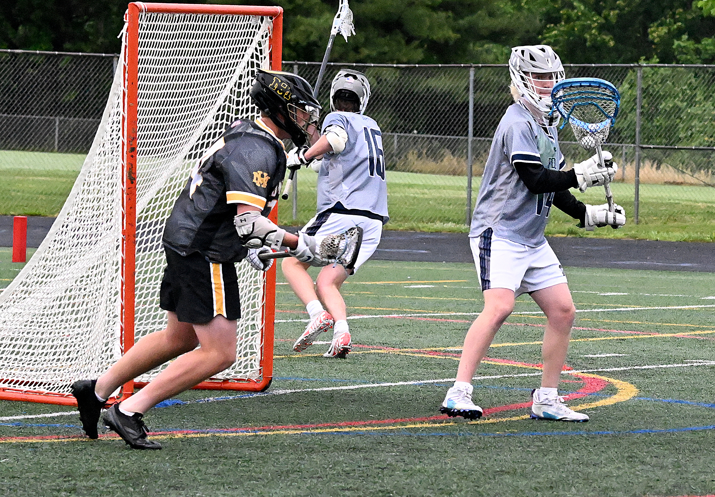 Marriotts Ridge goalie #14, Ian Murphy makes a save on...