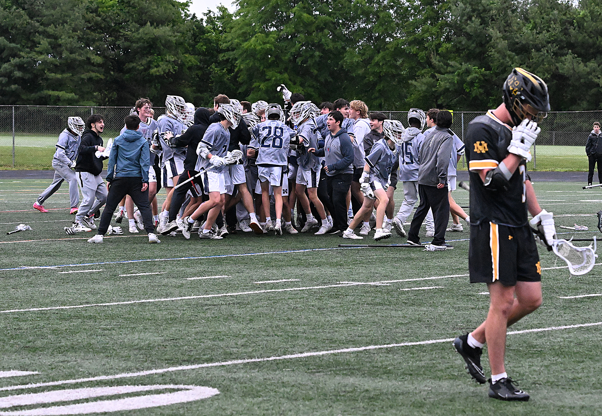 Marriotts Ridge boys lacrosse celebrates its regional semifinal win over...