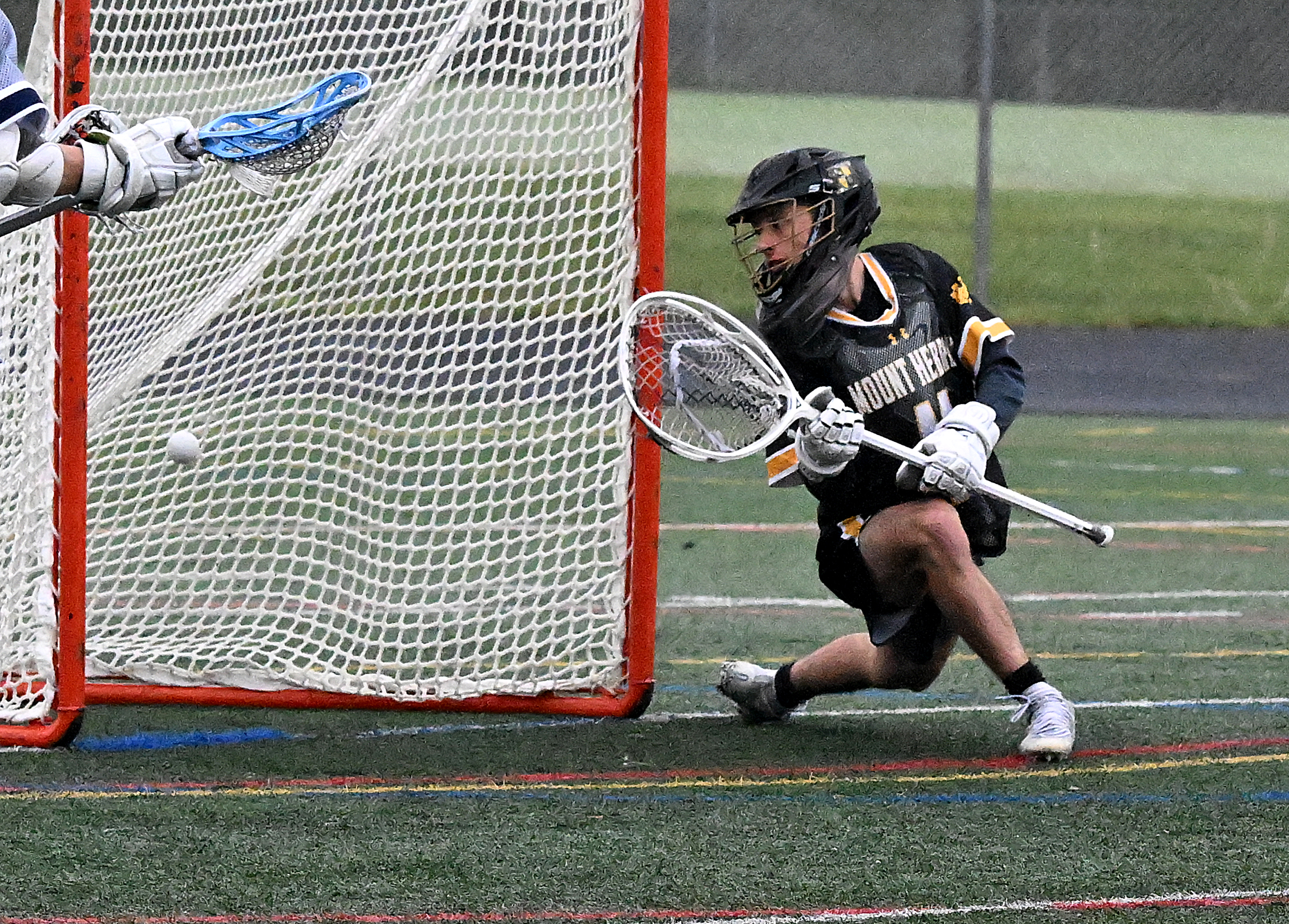 Mt. Hebron goalie #11, Luca LeClaire, can't catch up to...