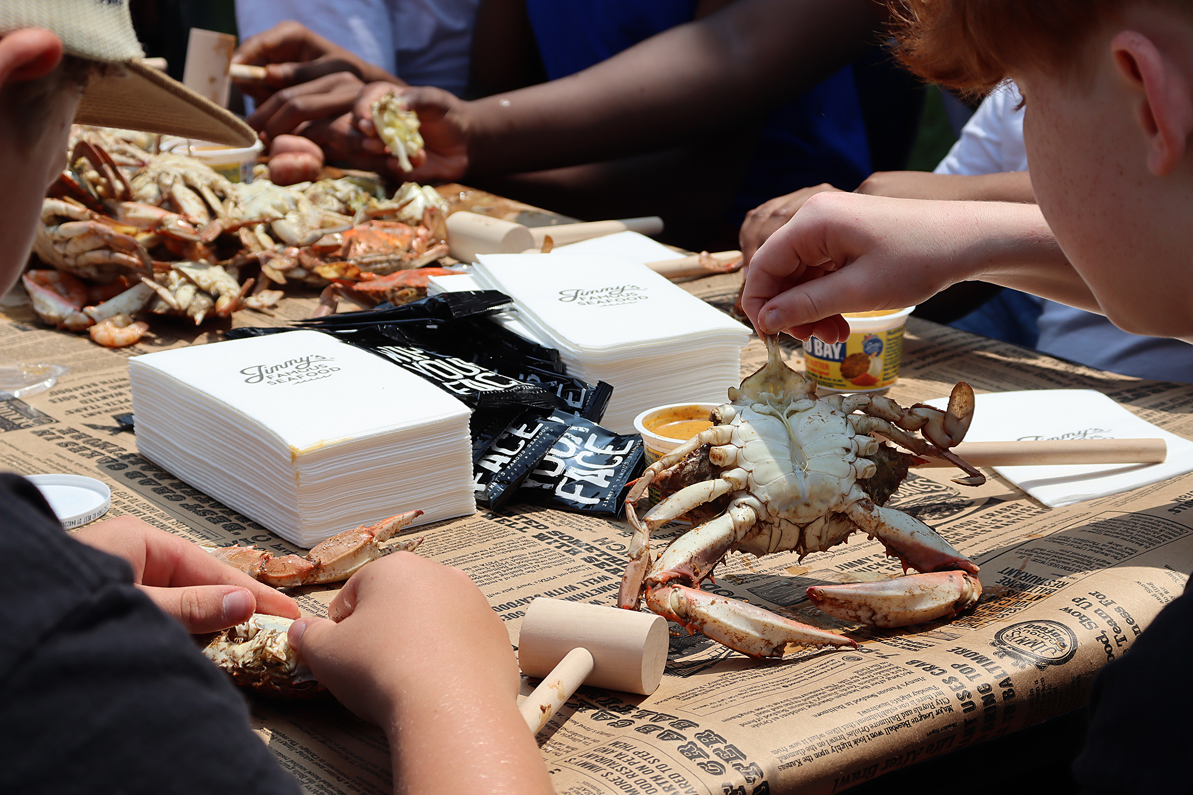 Annapolis Middle School Grill Masters Club members inspect their freshly...