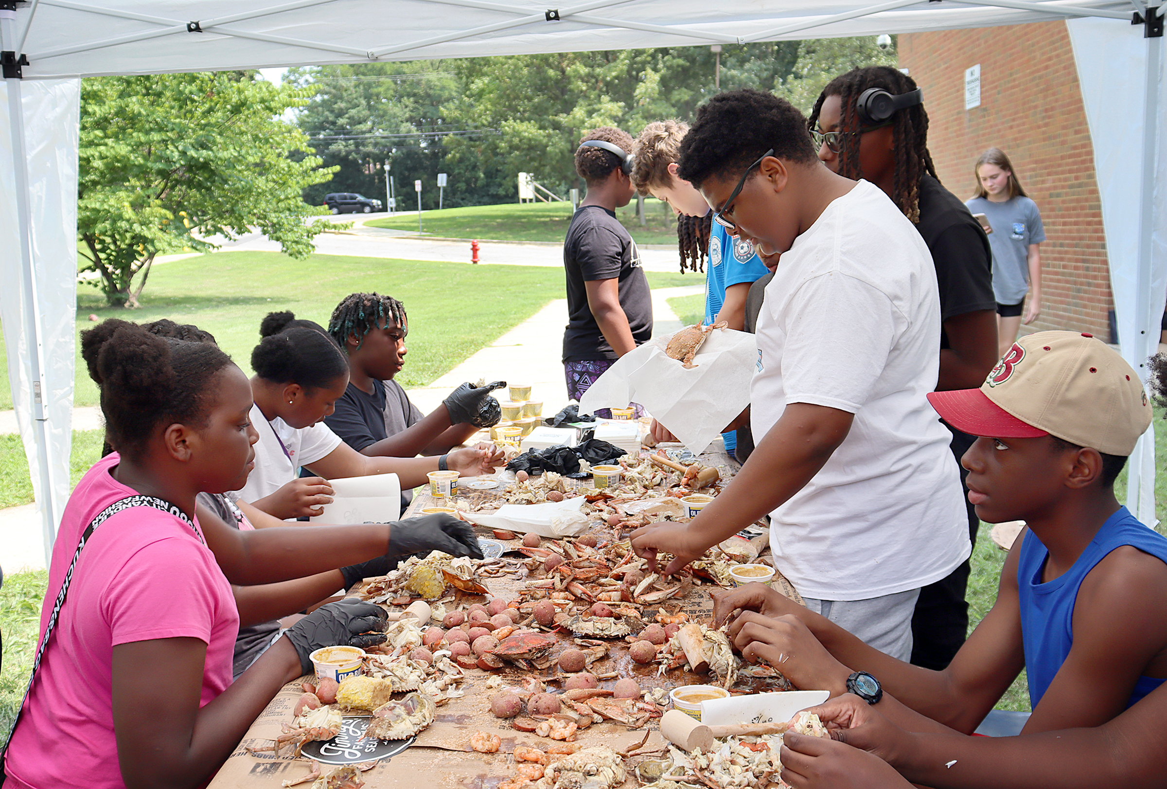 Members of Annapolis Middle School’s Grill Masters Club feast on...