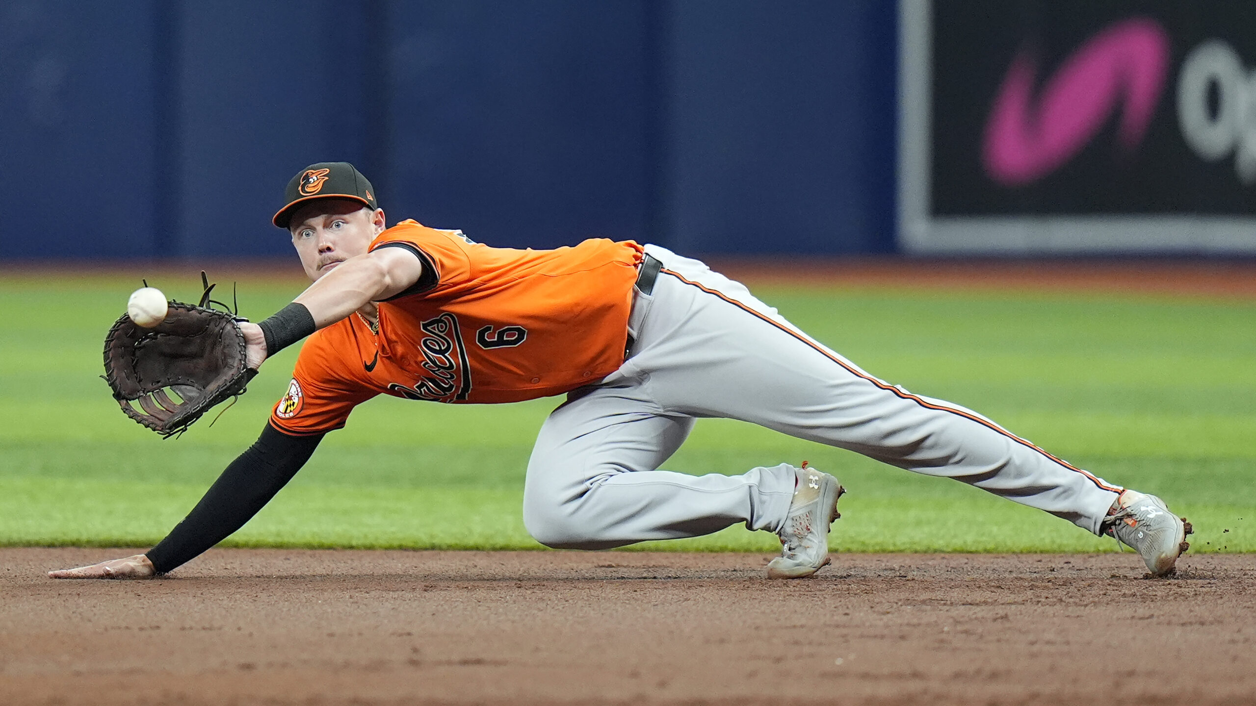 Baltimore Orioles first baseman Ryan Mountcastle makes a diving catch...