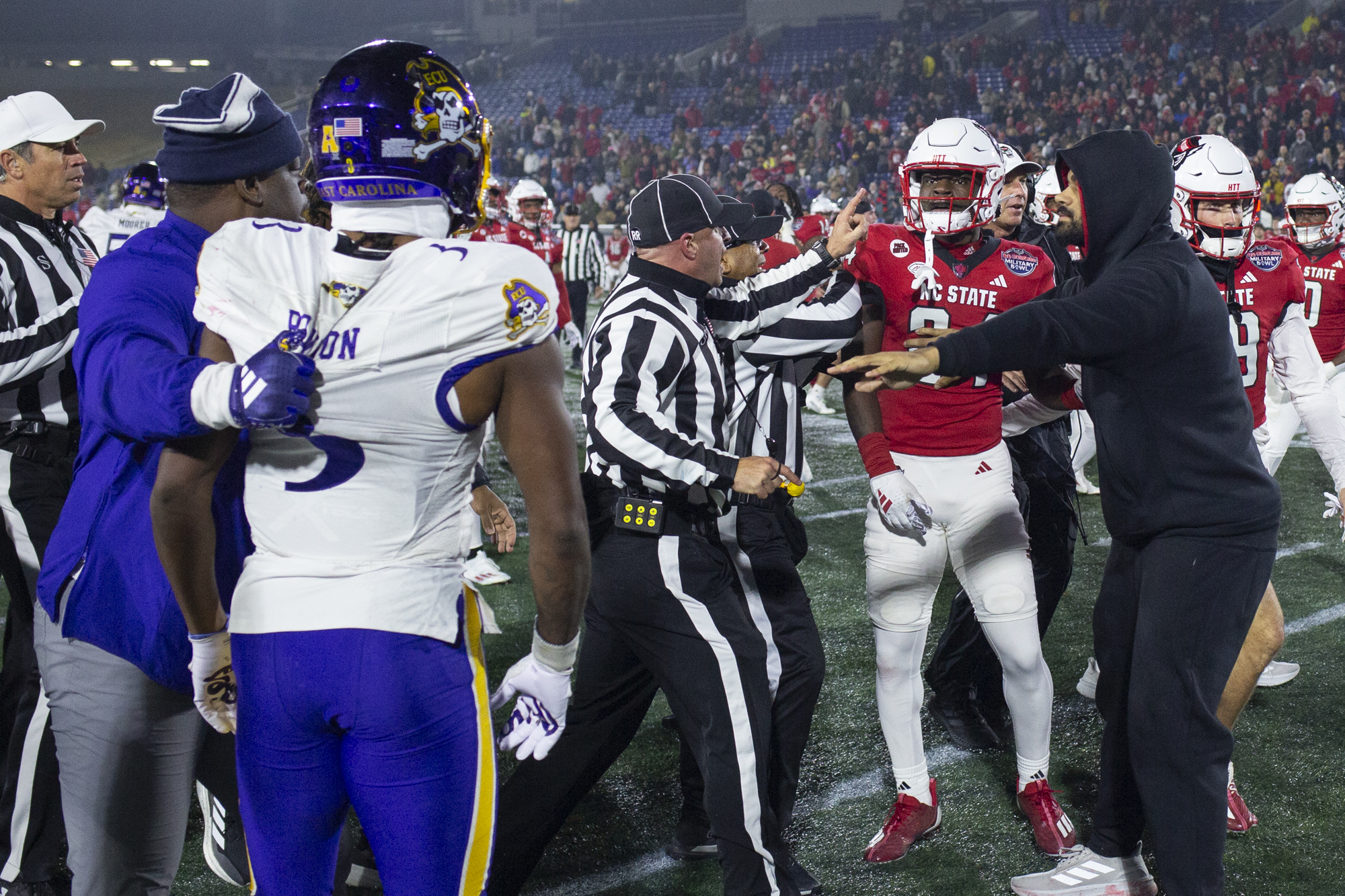 Dec. 28, 2024: ECU and NC State players square off...